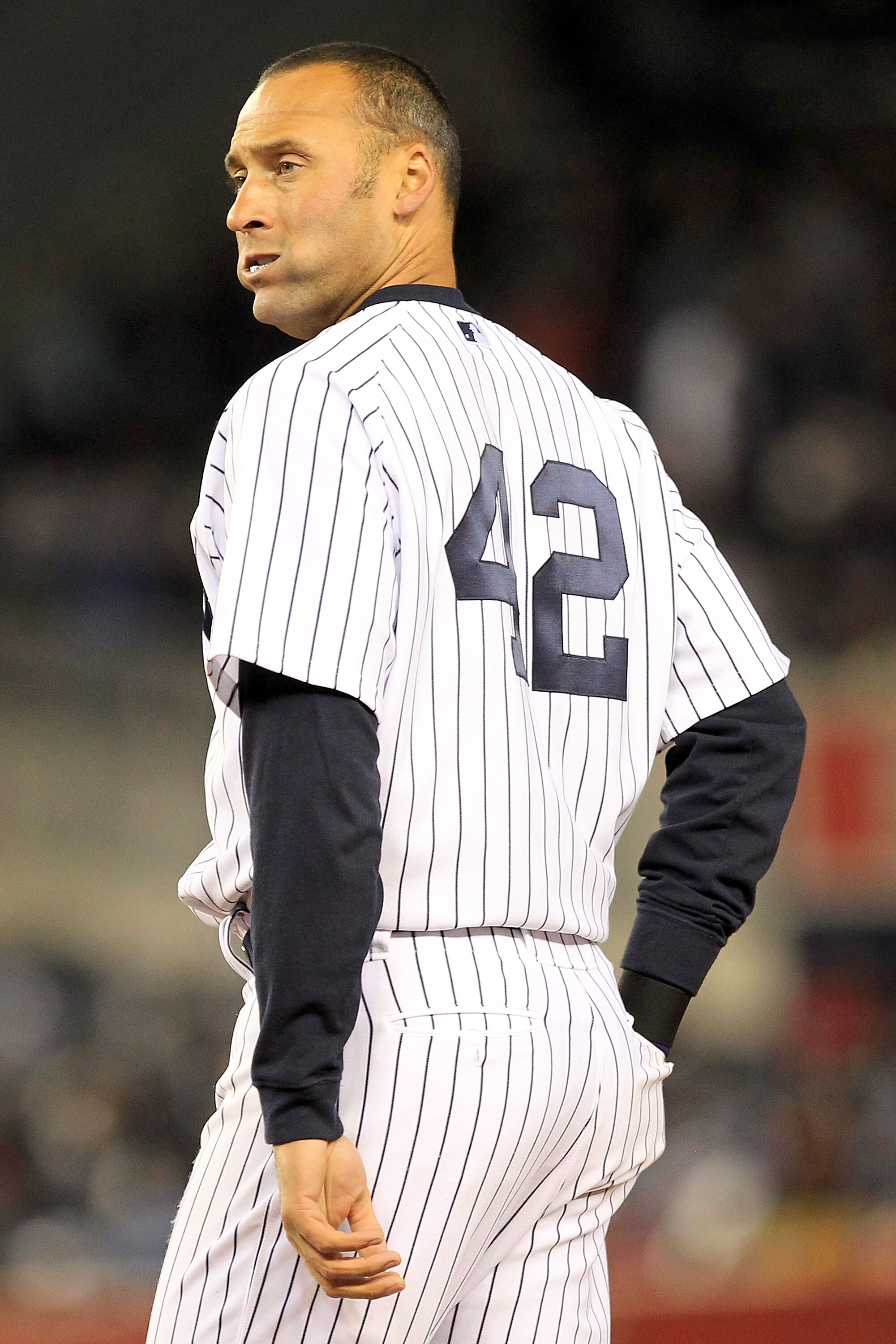 NEW YORK, NY - APRIL 15:  Derek Jeter of the New York Yankees wears the #42 jersey to commemorate Jackie Robinson Day during the game against the Texas Rangers at Yankee Stadium on April 15, 2011 in the Bronx borough of New York City.  (Photo by Chris Tro