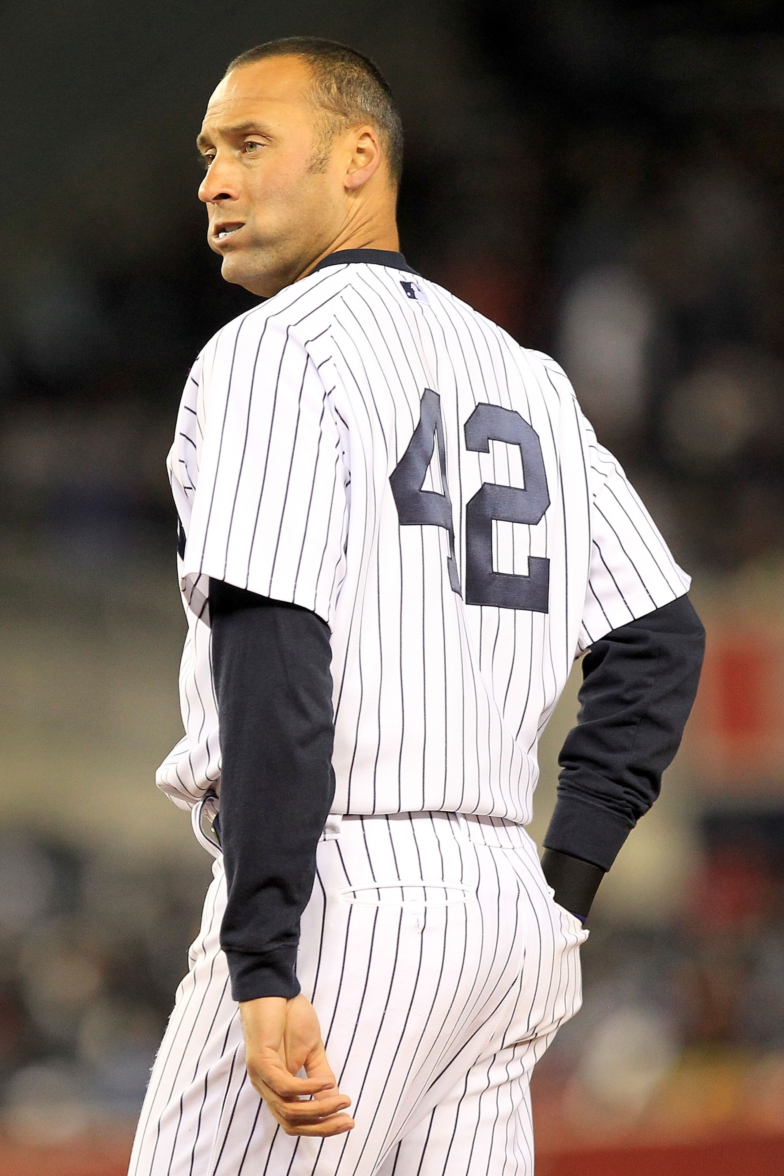 NEW YORK, NY - APRIL 15:  Derek Jeter of the New York Yankees wears the #42 jersey to commemorate Jackie Robinson Day during the game against the Texas Rangers at Yankee Stadium on April 15, 2011 in the Bronx borough of New York City.  (Photo by Chris Tro
