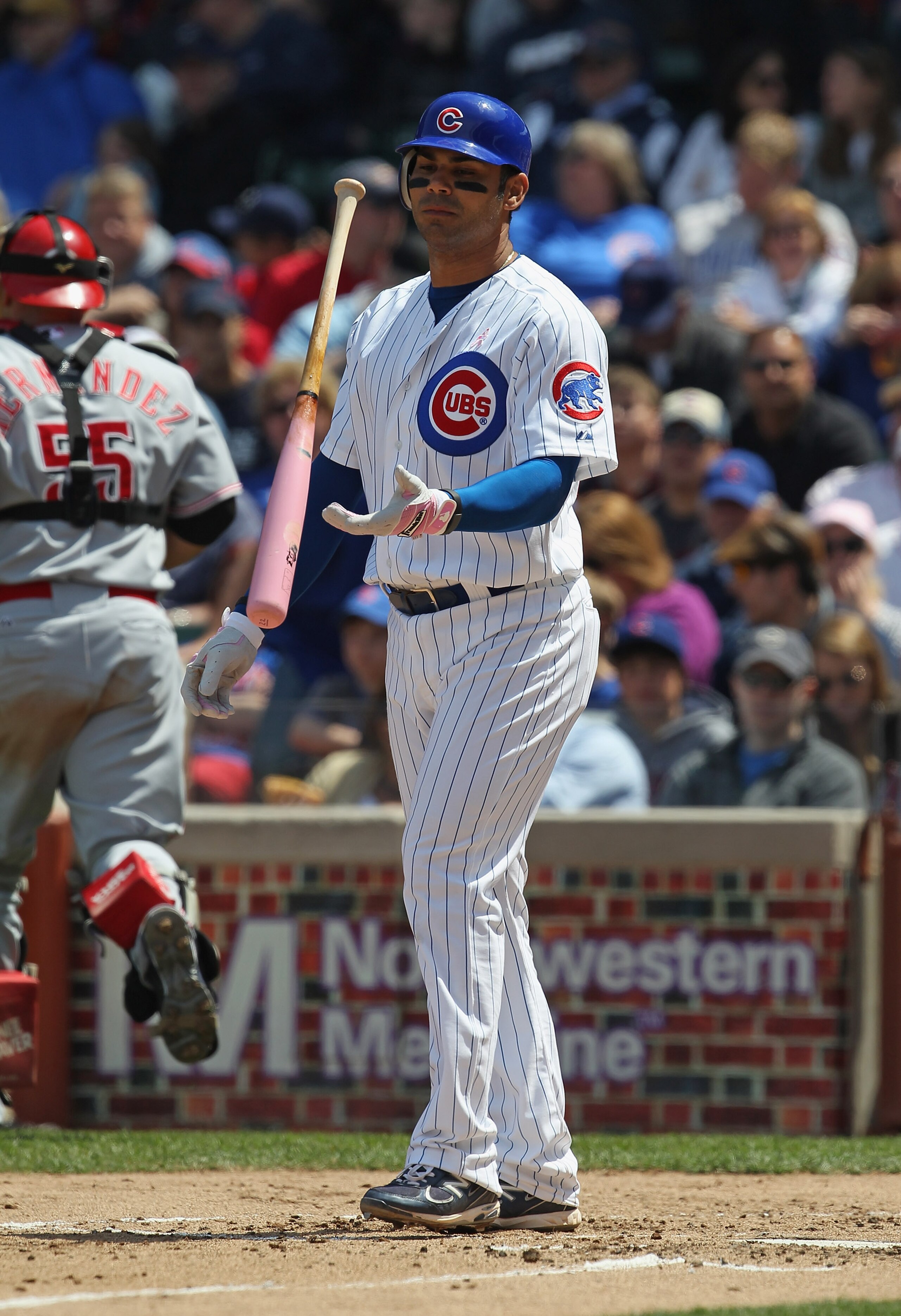 CHICAGO, IL - MAY 08: Carlos Pena #22 of the Chicago Cubs flips his bat after striking out against the Cincinnati Reds at Wrigley Field on May 8, 2011 in Chicago, Illinois. The Reds defeated the Cubs 2-0.  (Photo by Jonathan Daniel/Getty Images)