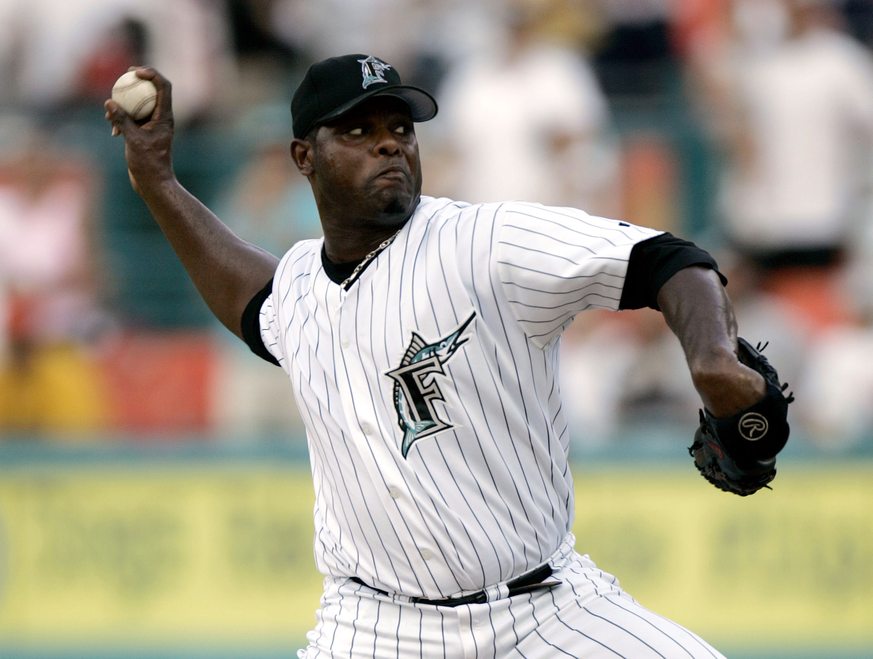 MIAMI - JULY 11:  Pitcher Armando Benitez #49 of the Florida Marlins pitches against the New York Mets in the ninth inning on July 11, 2004 at Pro Player Stadium in Miami, Florida. Benitez recorded his 30th save of the season as Florida defeated the Mets