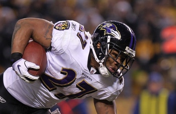 PITTSBURGH, PA - JANUARY 15:  Running back Ray Rice #27 of the Baltimore Ravens runs with the ball after being hit by safety Troy Polamalu #43 of the Pittsburgh Steelers in the AFC Divisional Playoff Game at Heinz Field on January 15, 2011 in Pittsburgh,