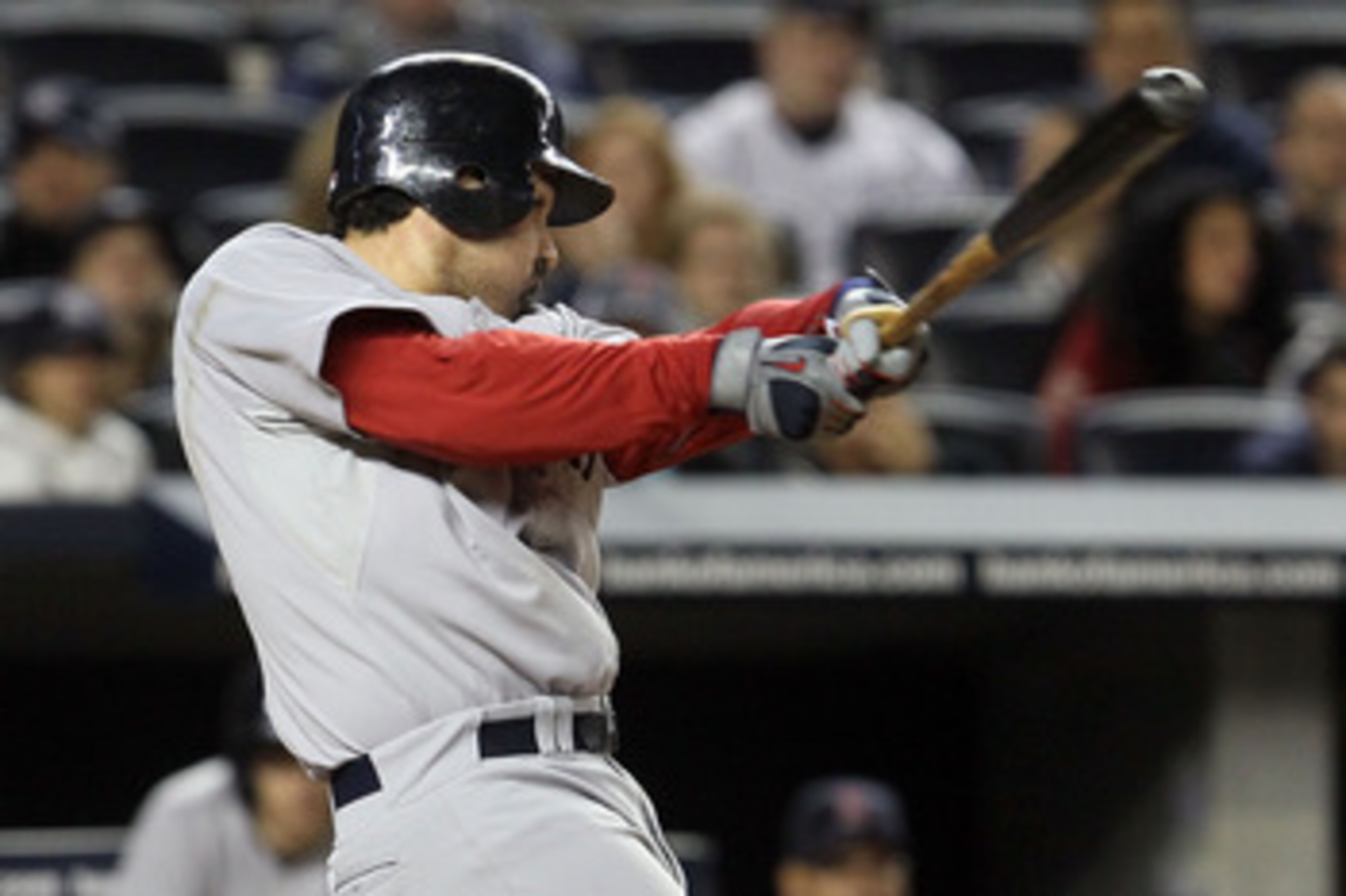 NEW YORK, NY - MAY 14:  Adrian Gonzalez #28 of the Boston Red Sox follows through on a seventh inning three run home run against the New York Yankees on May 14, 2011 at Yankee Stadium in the Bronx borough of New York City.  (Photo by Jim McIsaac/Getty Ima
