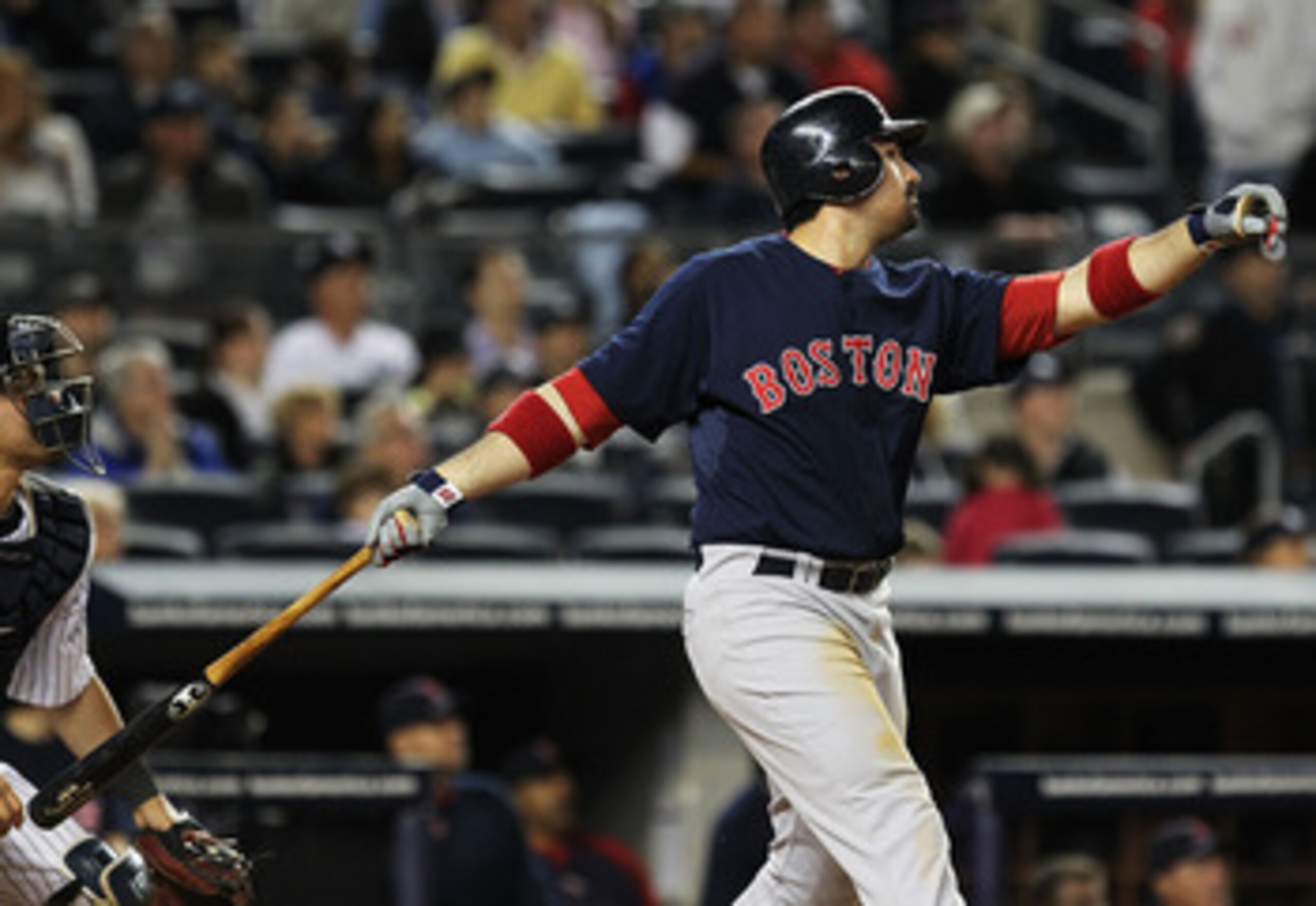 NEW YORK, NY - MAY 13:  Adrian Gonzalez #28 of the Boston Red Sox drives in a run with a sacrifice fly against the New York Yankees during their game on May 13, 2011 at Yankee Stadium in the Bronx borough of New York City.  (Photo by Al Bello/Getty Images