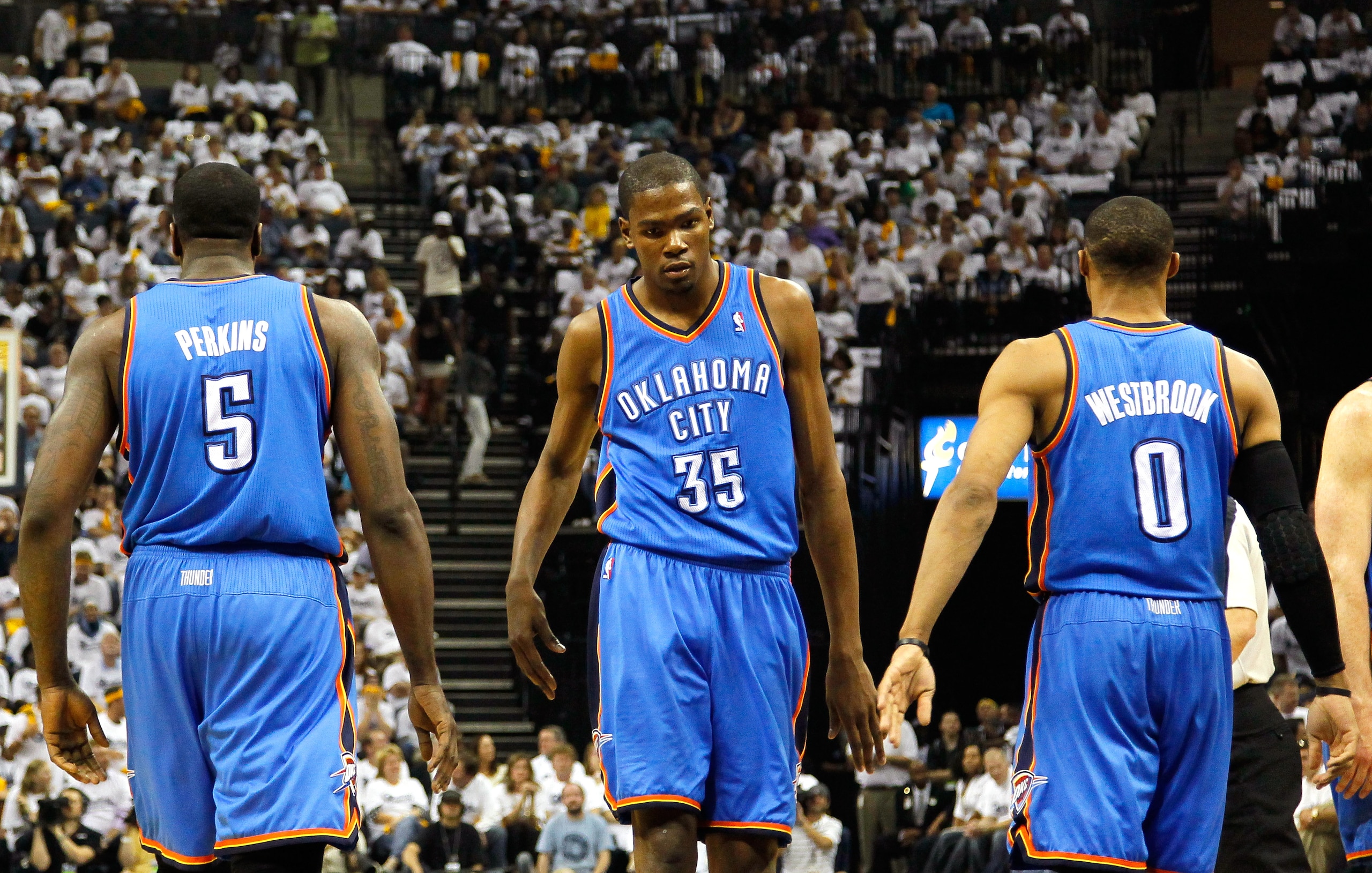 MEMPHIS, TN - MAY 13:  Kevin Durant #35 reacts with Kendrick Perkins #5 and Russell Westbrook #0 of the Oklahoma City Thunder after Perkins' basket and a foul against the Memphis Grizzlies in Game Six of the Western Conference Semifinals in the 2011 NBA P