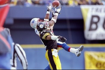 3 Jan 1998: Wide receiver Yancy Thigpen of the Pittsburgh Steelers and cornerback Ty Law of the New England Patriots jump for the ball during a playoff game at Three Rivers Stadium in Pittsburgh, Pennsylvania. The Steelers won the game 7-6.