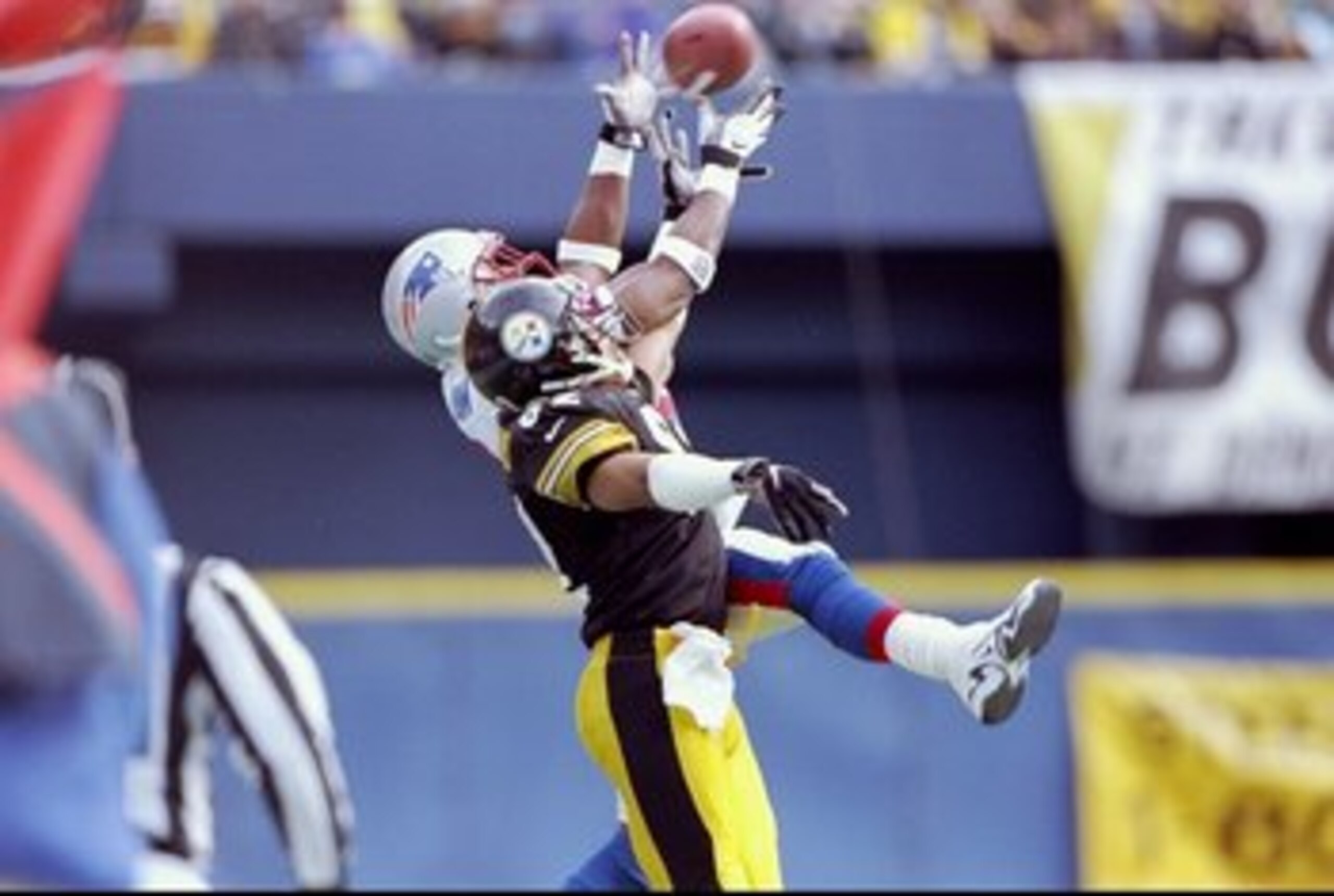 3 Jan 1998: Wide receiver Yancy Thigpen of the Pittsburgh Steelers and cornerback Ty Law of the New England Patriots jump for the ball during a playoff game at Three Rivers Stadium in Pittsburgh, Pennsylvania. The Steelers won the game 7-6.