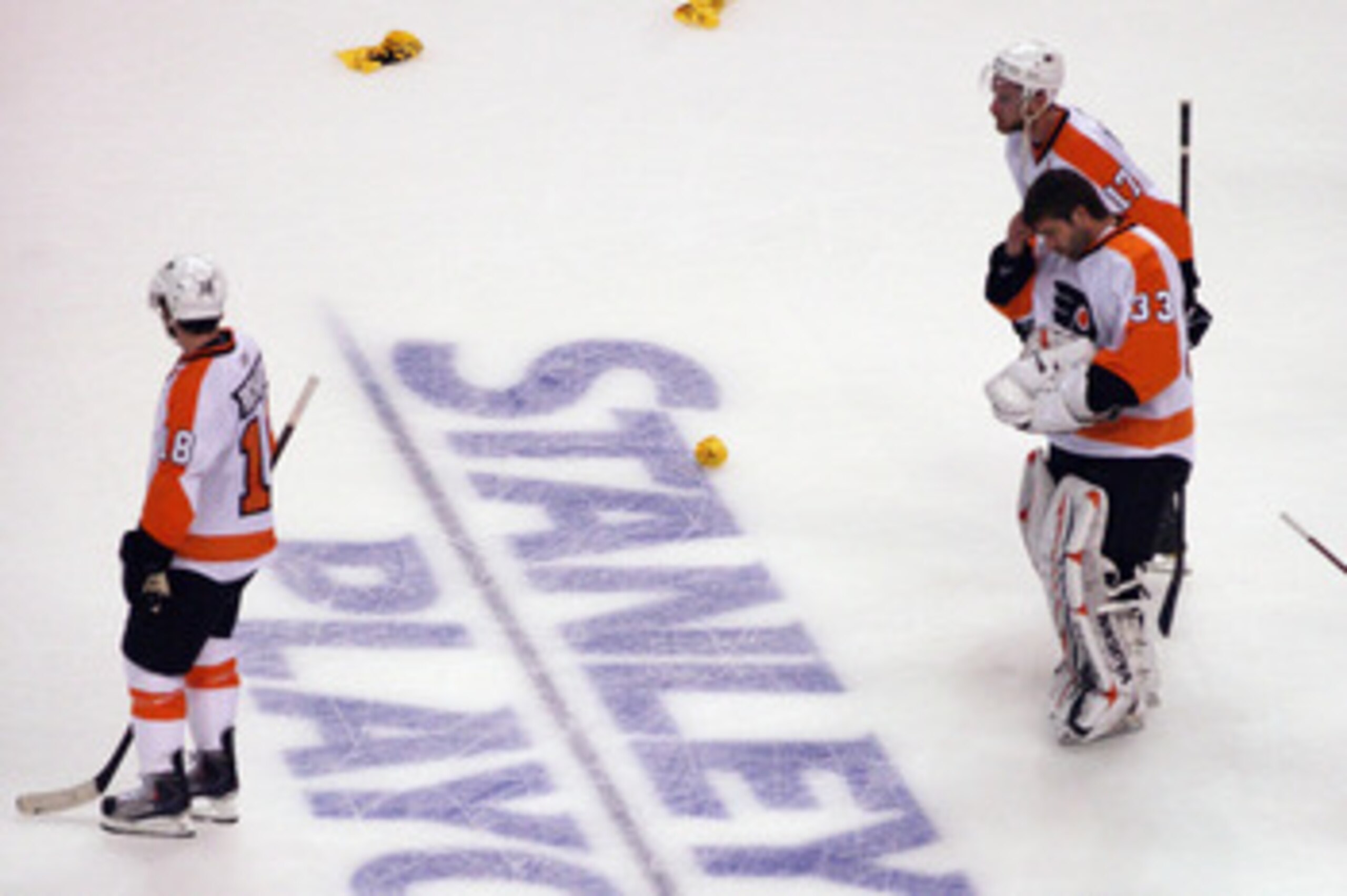 BOSTON, MA - MAY 06:  Jeff Carter #17, Brian Boucher #33, and Mike Richards #18 of the Philadelphia Flyers leave the ice following defeat at the hands of the Boston Bruins in Game Four of the Eastern Conference Semifinals during the 2011 NHL Stanley Cup P