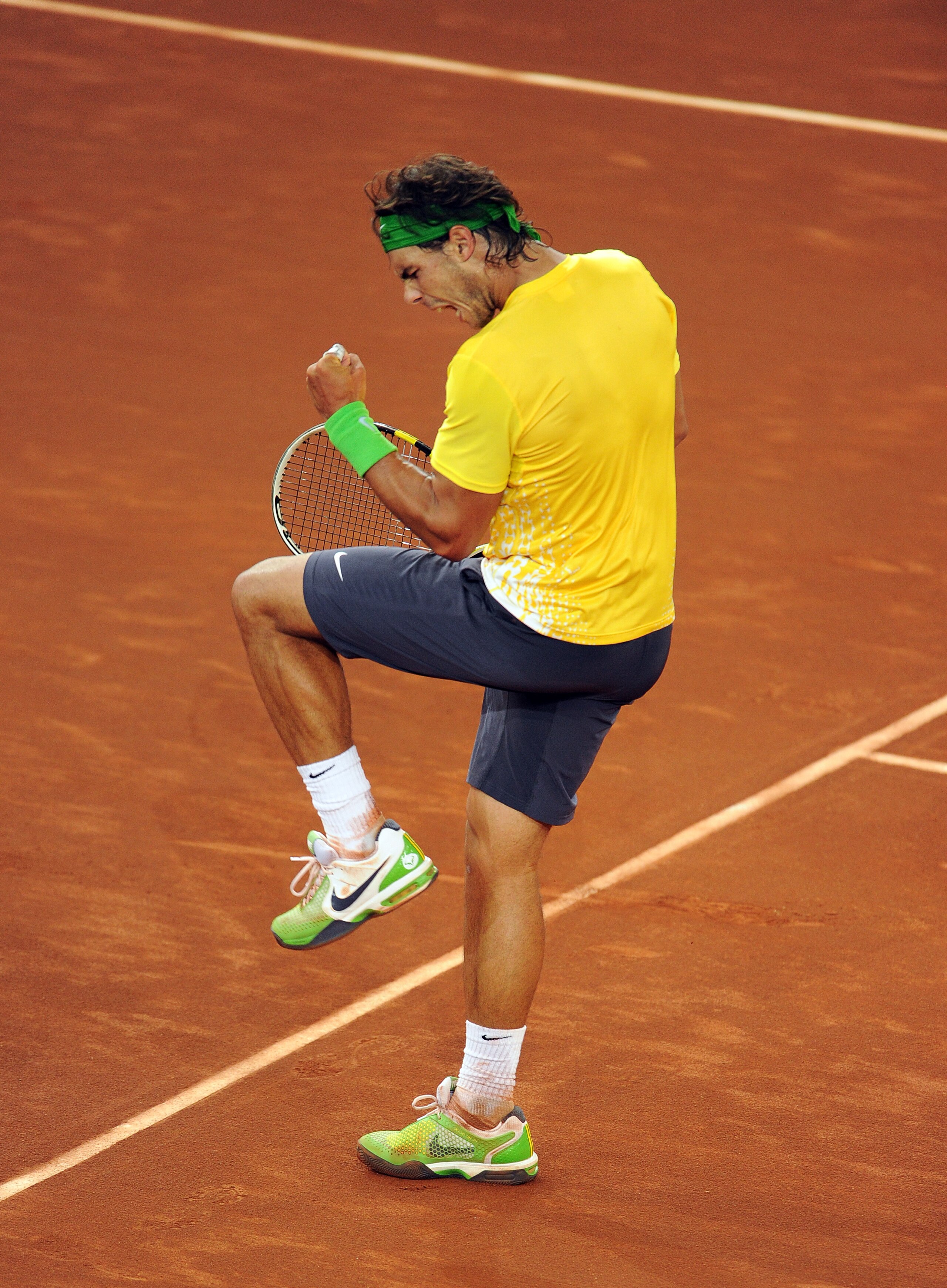MADRID, SPAIN - MAY 07:  Rafael Nadal of Spain celebrates a breakpoint over Roger Federer of Switzerland at the end of his semi final match during day seven of the Mutua Madrilena Madrid Open Tennis on May 7, 2011 in Madrid, Spain.  (Photo by Jasper Juine