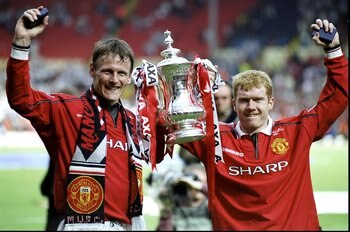 22 May 1999:  The two goal scorers Teddy Sheringham and Paul Scholes of Manchester United celebrate victory with the trophy after the AXA FA Cup Final match against Newcastle United played at Wembley Stadium in London, England.  The match finished in a 2-