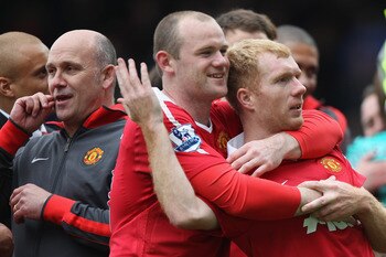 BLACKBURN, ENGLAND - MAY 14:  Wayne Rooney (L) and Paul Scholes (R) of Manchester United celebrate clinching the title during the Barclays Premier League match between Blackburn Rovers and Manchester United at Ewood Park on May 14, 2011 in Blackburn, Engl