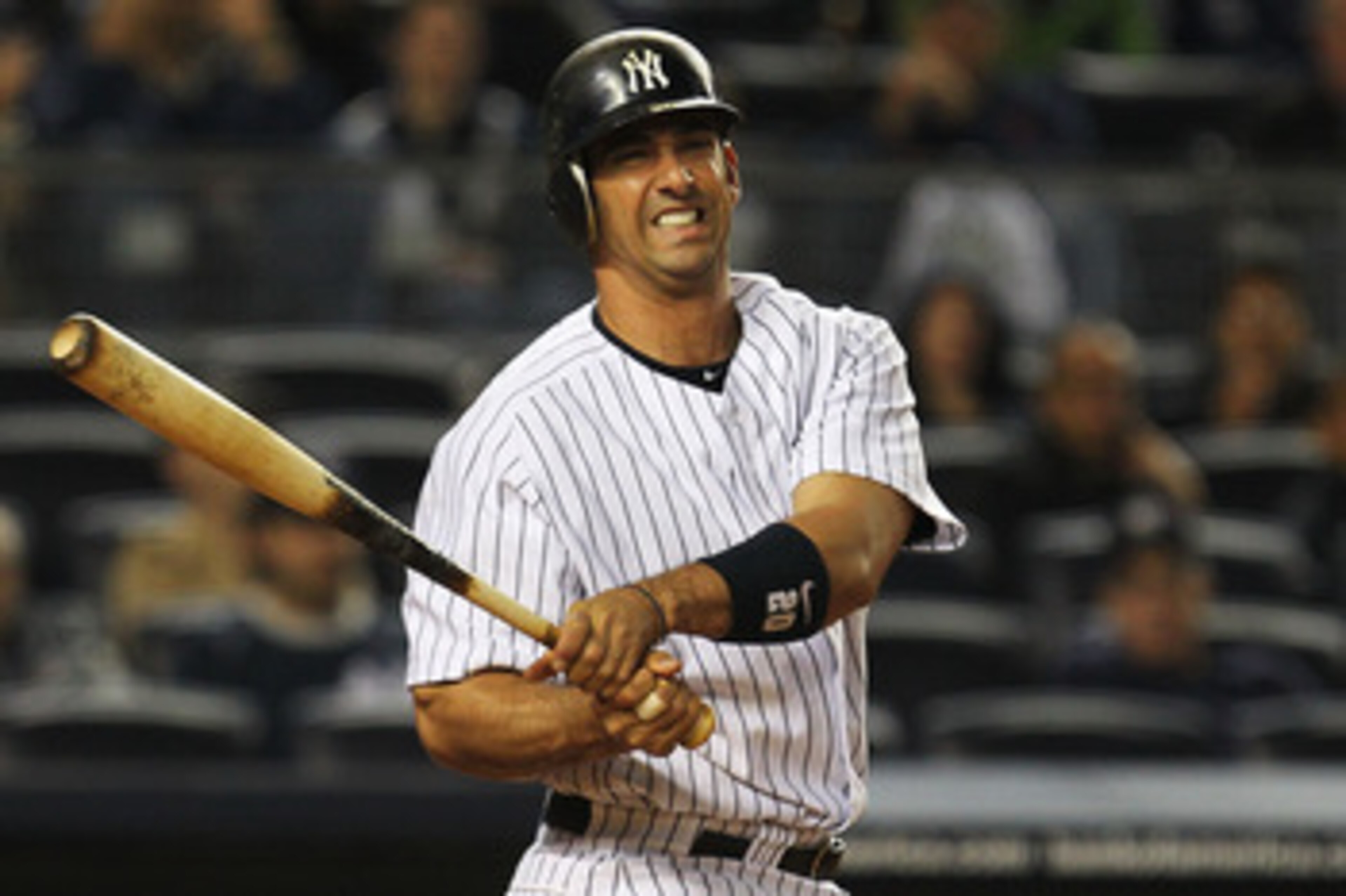 NEW YORK, NY - MAY 15:  Jorge Posada #20 of the New York Yankees reacts after missing a pitch against the Boston Red Sox during their game on May 15, 2011 at Yankee Stadium in the Bronx borough of New York City.  (Photo by Al Bello/Getty Images)