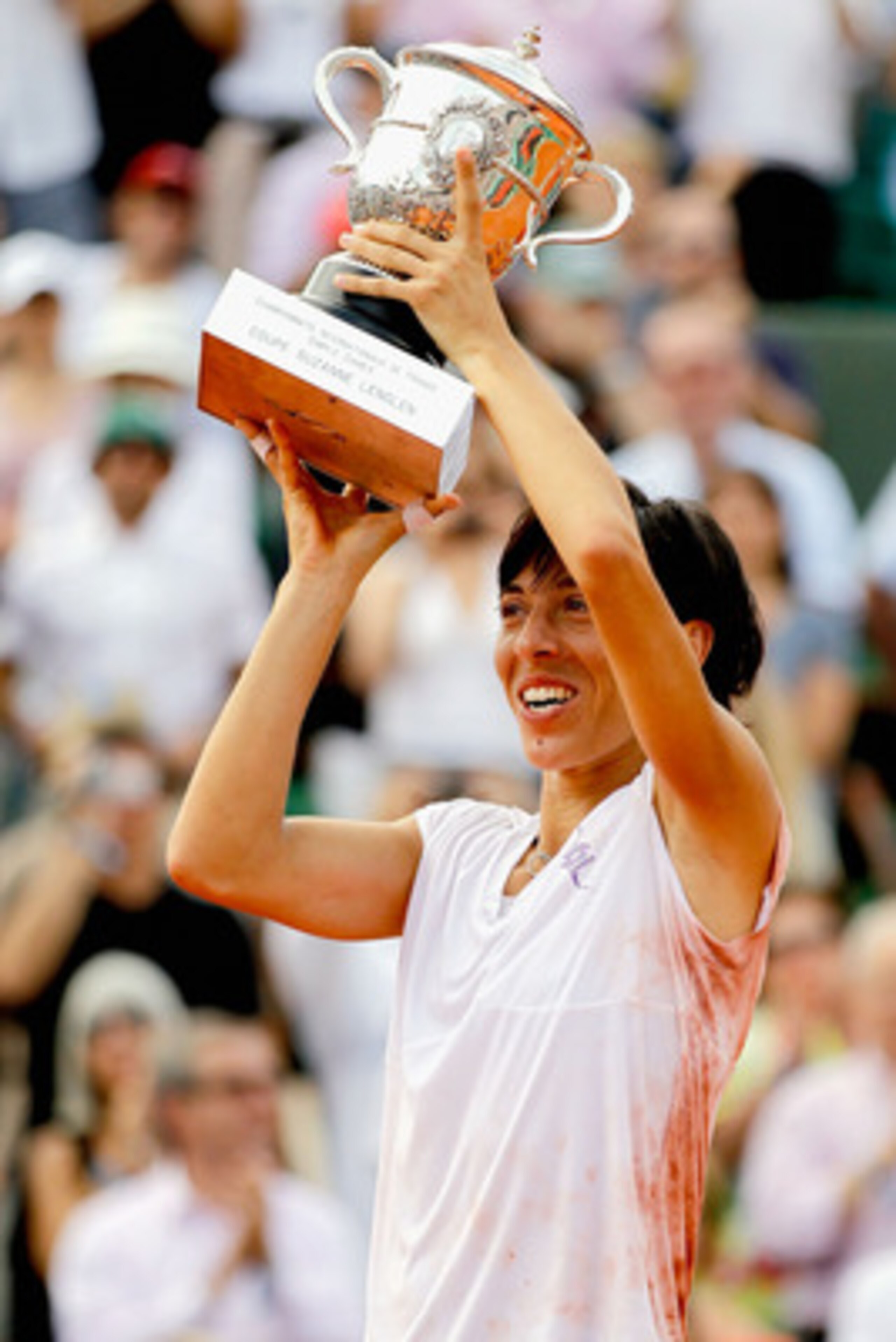 PARIS - JUNE 05:  Francesca Schiavone of Italy celebrates with the trophy after winning the women's singles final match between Francesca Schiavone of Italy and Samantha Stosur of Australia on day fourteen of the French Open at Roland Garros on June 5, 20