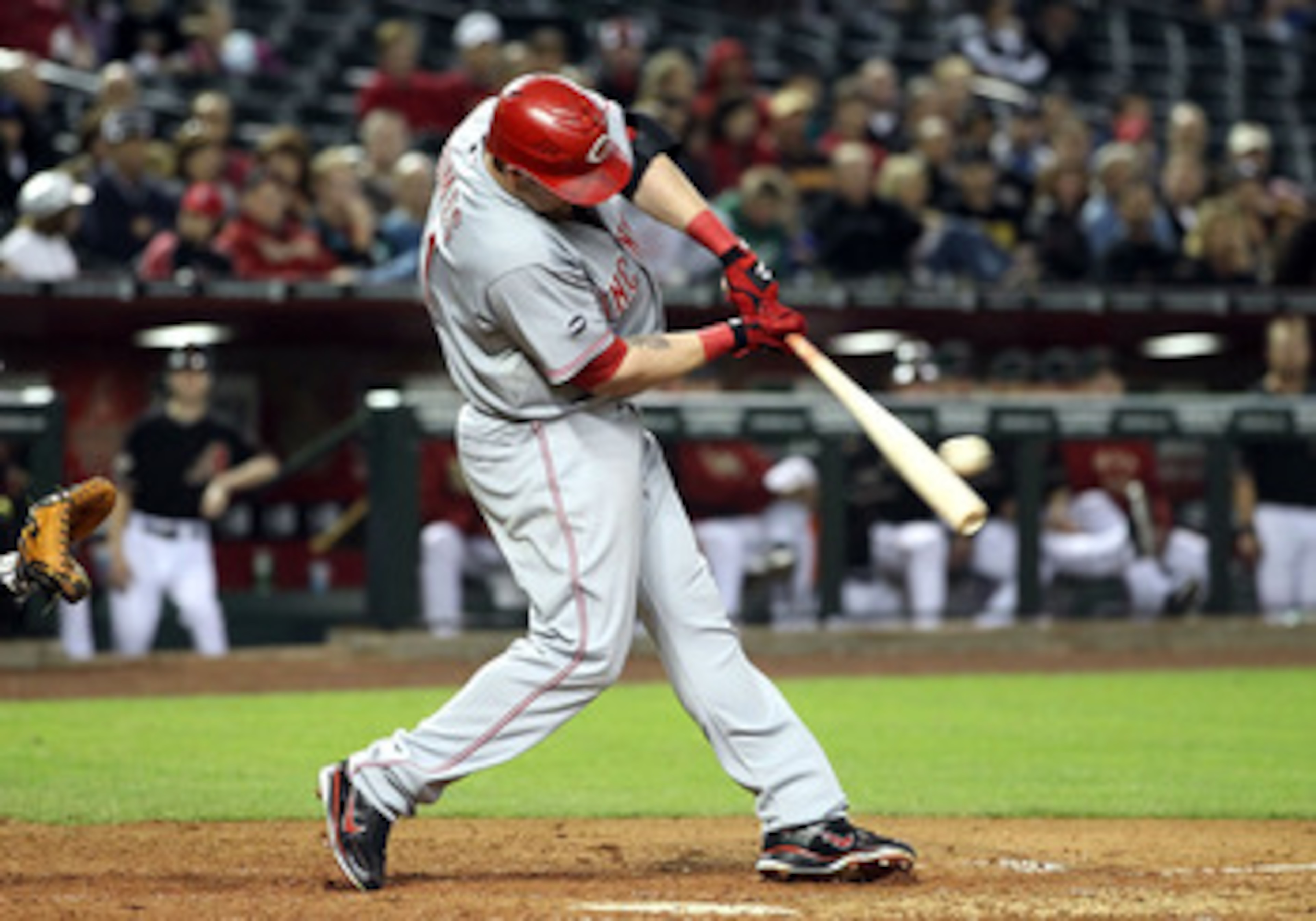 PHOENIX, AZ - APRIL 09:  Jonny Gomes #31 of the Cincinnati Reds hits a 2 RBI double against the Arizona Diamondbacks during the ninth inning of the Major League Baseball game at Chase Field on April 9, 2011 in Phoenix, Arizona.  (Photo by Christian Peters