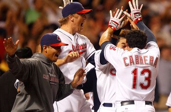 CLEVELAND - MAY 13:  Shin-Soo Choo #17, Asdrubal Cabrera #13, and Shelley Duncan #47 of the Cleveland Indians celebrate following the walk-off two run home run by Travis Hafner #48 against the Seattle Mariners during the game on May 13, 2011 at Progressiv
