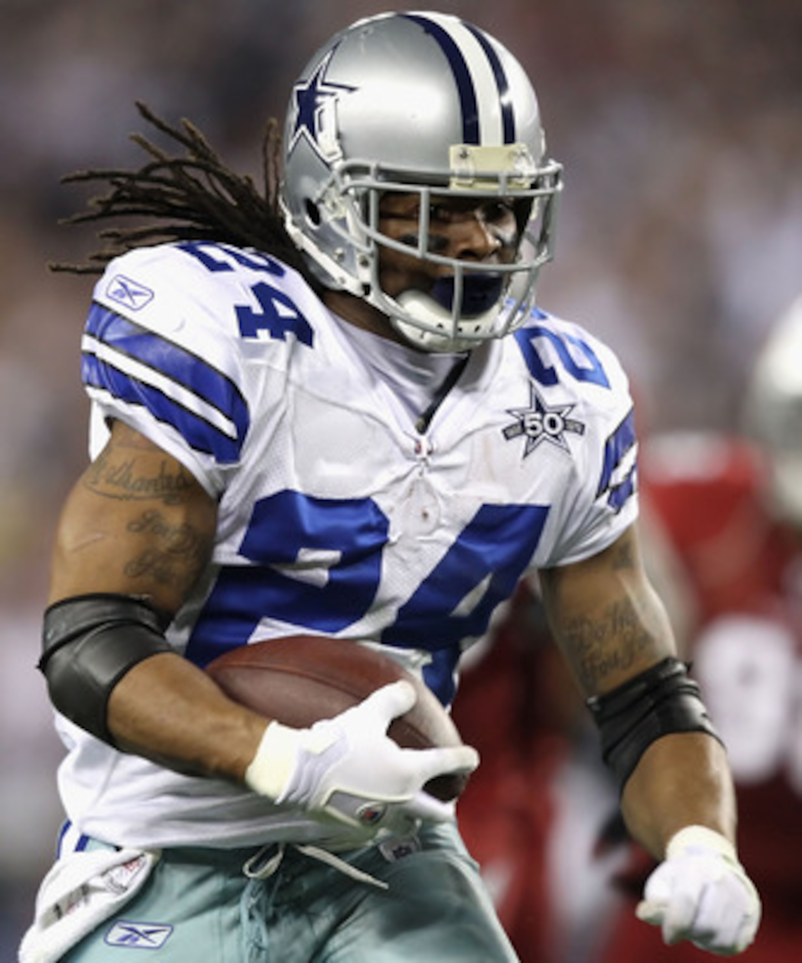 GLENDALE, AZ - DECEMBER 25:  Runningback Marion Barber #24 of the Dallas Cowboys rushes the football during the NFL game against the Arizona Cardinals at the University of Phoenix Stadium on December 25, 2010 in Glendale, Arizona.  The Cardinals defeated