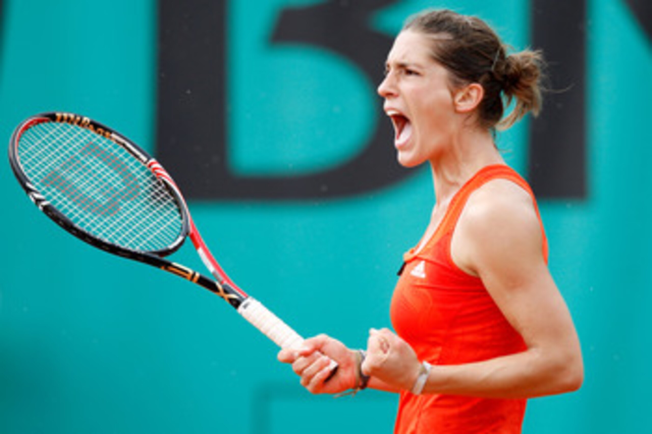 PARIS - MAY 26:  Andrea Petkovic of Germany celebrates during the women's singles second round match between Svetlana Kuznetsova of Russia and Andrea Petkovic of Germany on day four of the French Open at Roland Garros on May 26, 2010 in Paris, France.  (P