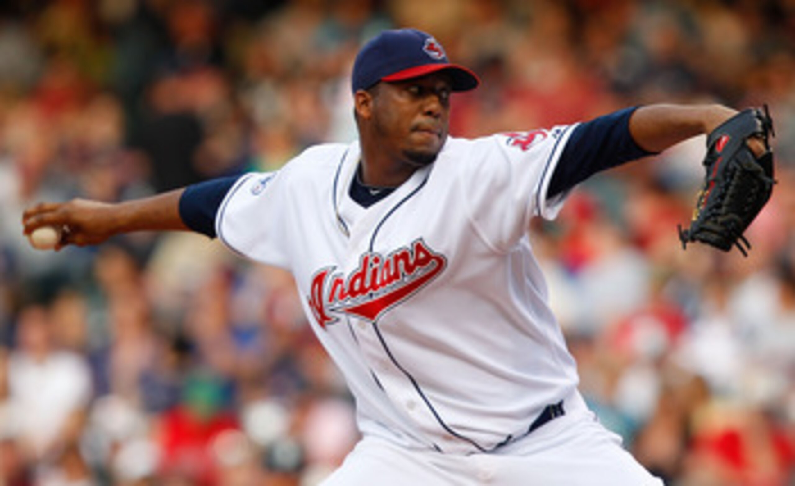CLEVELAND - MAY 13:  Fausto Carmona #55 of the Cleveland Indians pitches against the Seattle Mariners during the game on May 13, 2011 at Progressive Field in Cleveland, Ohio.  (Photo by Jared Wickerham/Getty Images)