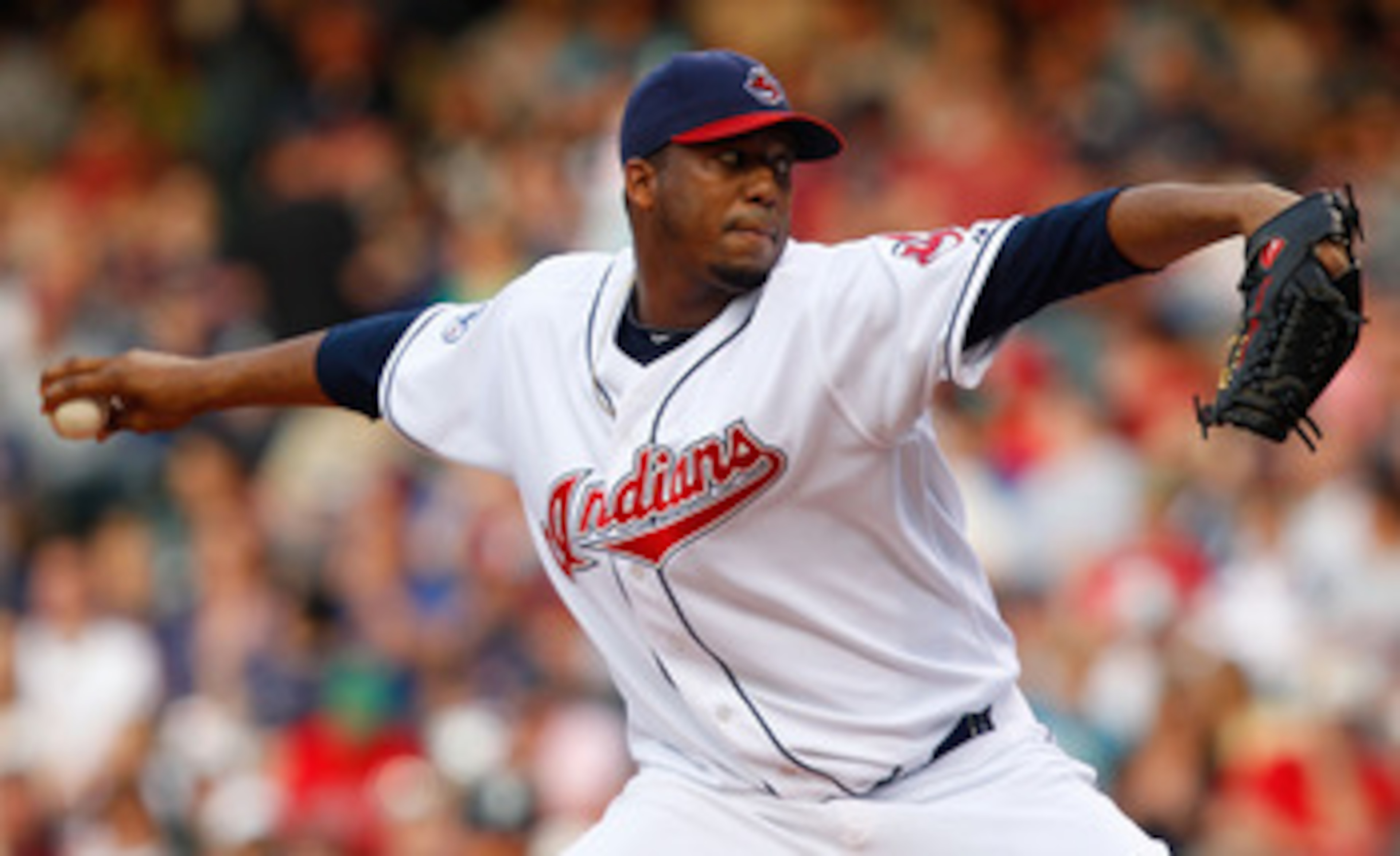 CLEVELAND - MAY 13:  Fausto Carmona #55 of the Cleveland Indians pitches against the Seattle Mariners during the game on May 13, 2011 at Progressive Field in Cleveland, Ohio.  (Photo by Jared Wickerham/Getty Images)