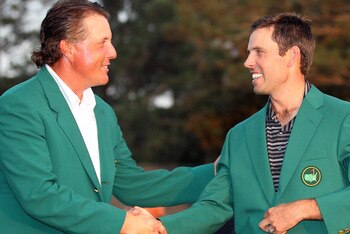 AUGUSTA, GA - APRIL 10: Charl Schwartzel of South Africa is presented with his Green Jacket by Phil Mickelson for winning the Masters after the final round of the 2011 Masters Tournament at Augusta National Golf Club on April 10, 2011 in Augusta, Georgia AUGUSTA, GA - APRIL 10: Charl Schwartzel of South Africa is presented with his Green Jacket by Phil Mickelson for winning the Masters after the final round of the 2011 Masters Tournament at Augusta National Golf Club on April 10, 2011 in Augusta, Georgia