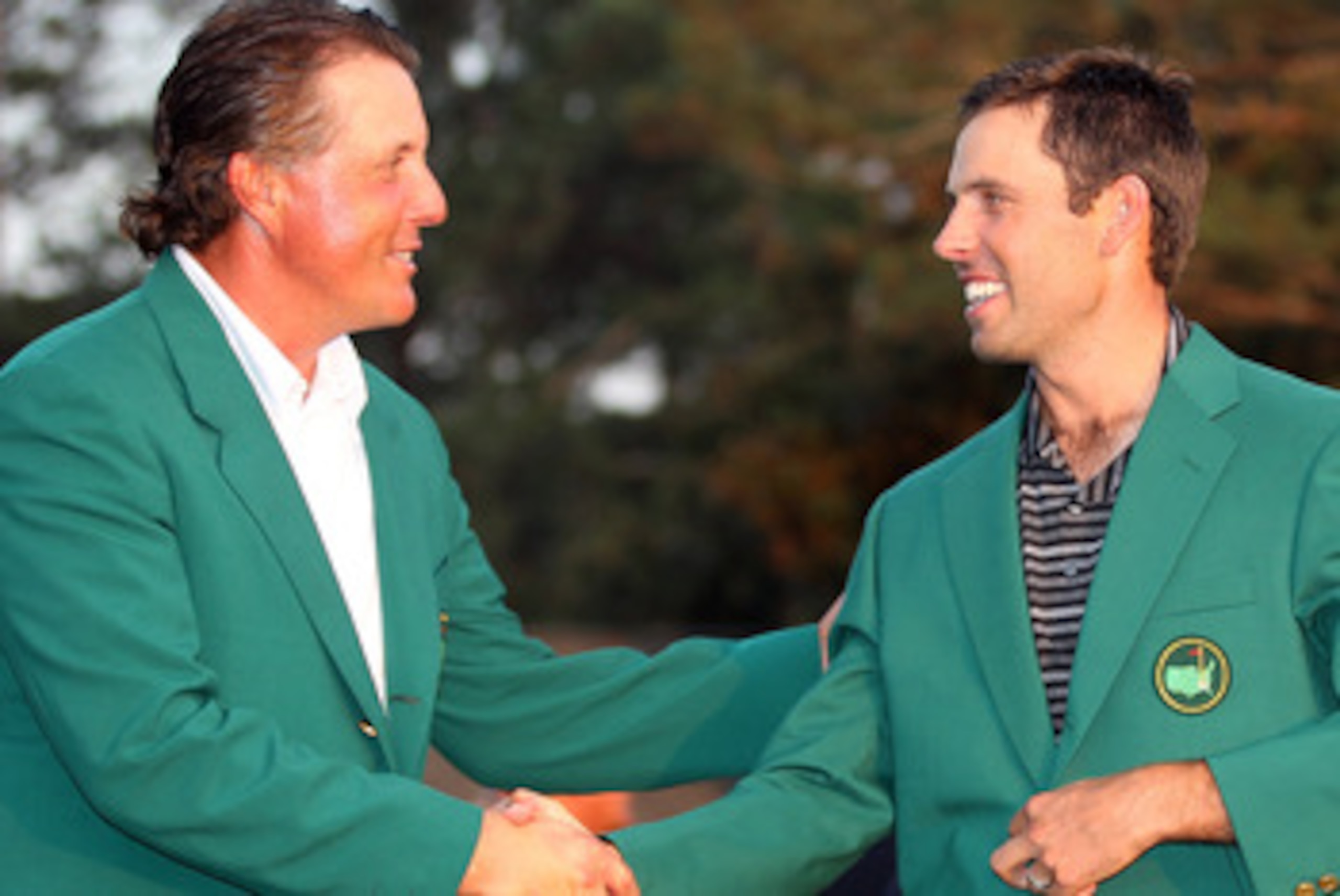 AUGUSTA, GA - APRIL 10: Charl Schwartzel of South Africa is presented with his Green Jacket by Phil Mickelson for winning the Masters after the final round of the 2011 Masters Tournament at Augusta National Golf Club on April 10, 2011 in Augusta, Georgia AUGUSTA, GA - APRIL 10: Charl Schwartzel of South Africa is presented with his Green Jacket by Phil Mickelson for winning the Masters after the final round of the 2011 Masters Tournament at Augusta National Golf Club on April 10, 2011 in Augusta, Georgia