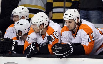 BOSTON, MA - MAY 06: Darroll Powe #36 and Daniel Carcillo #13 of the Philadelphia Flyers react late in the third period against the Boston Bruins in Game Four of the Eastern Conference Semifinals during the 2011 NHL Stanley Cup Playoffs at TD Garden on Ma