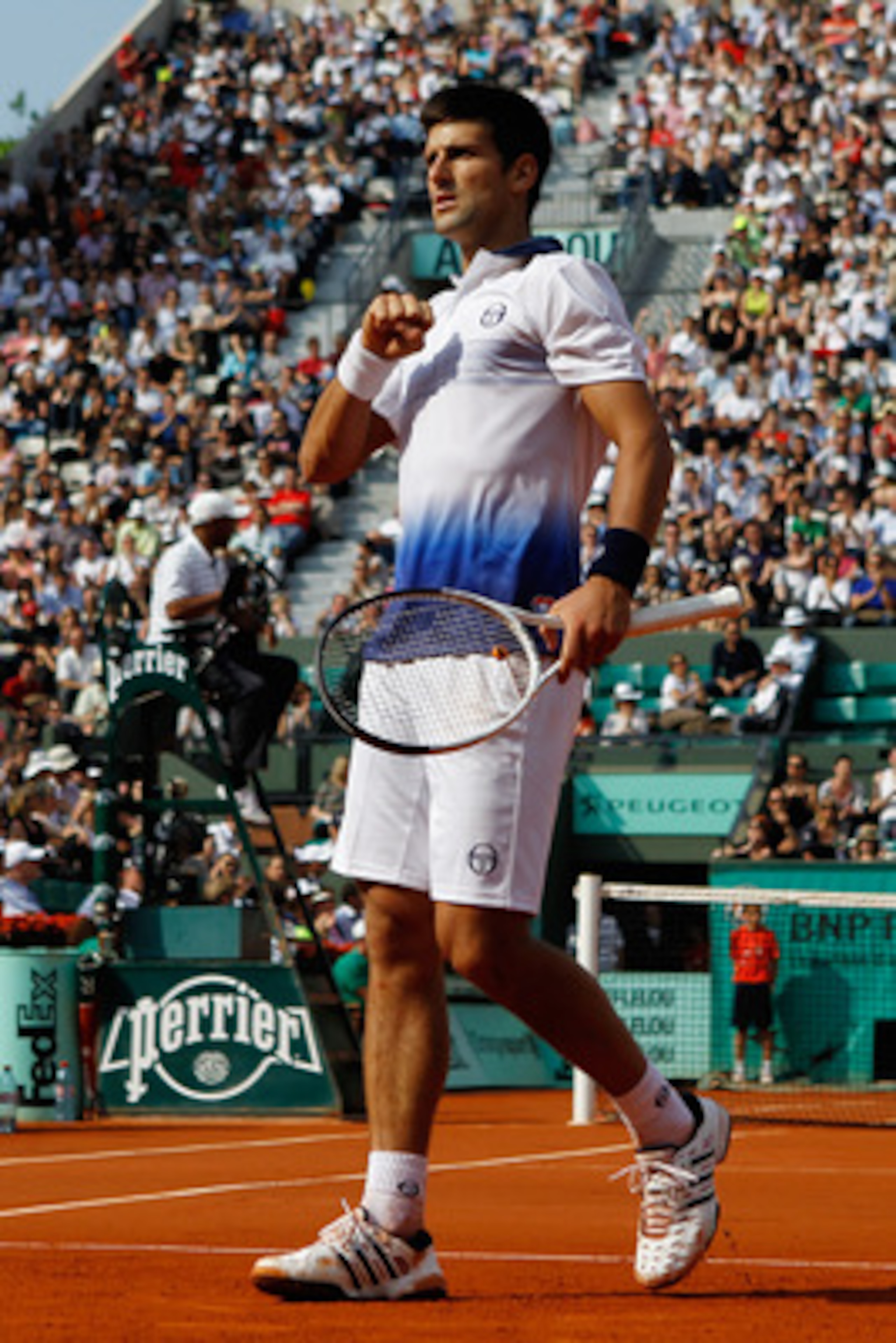 PARIS - JUNE 02:  Novak Djokovic of Serbia celebrates during the men's singles quarter final match between Novak Djokovic of Serbia and Jurgen Melzer of Austria at the French Open on day eleven of the French Open at Roland Garros on June 2, 2010 in Paris,