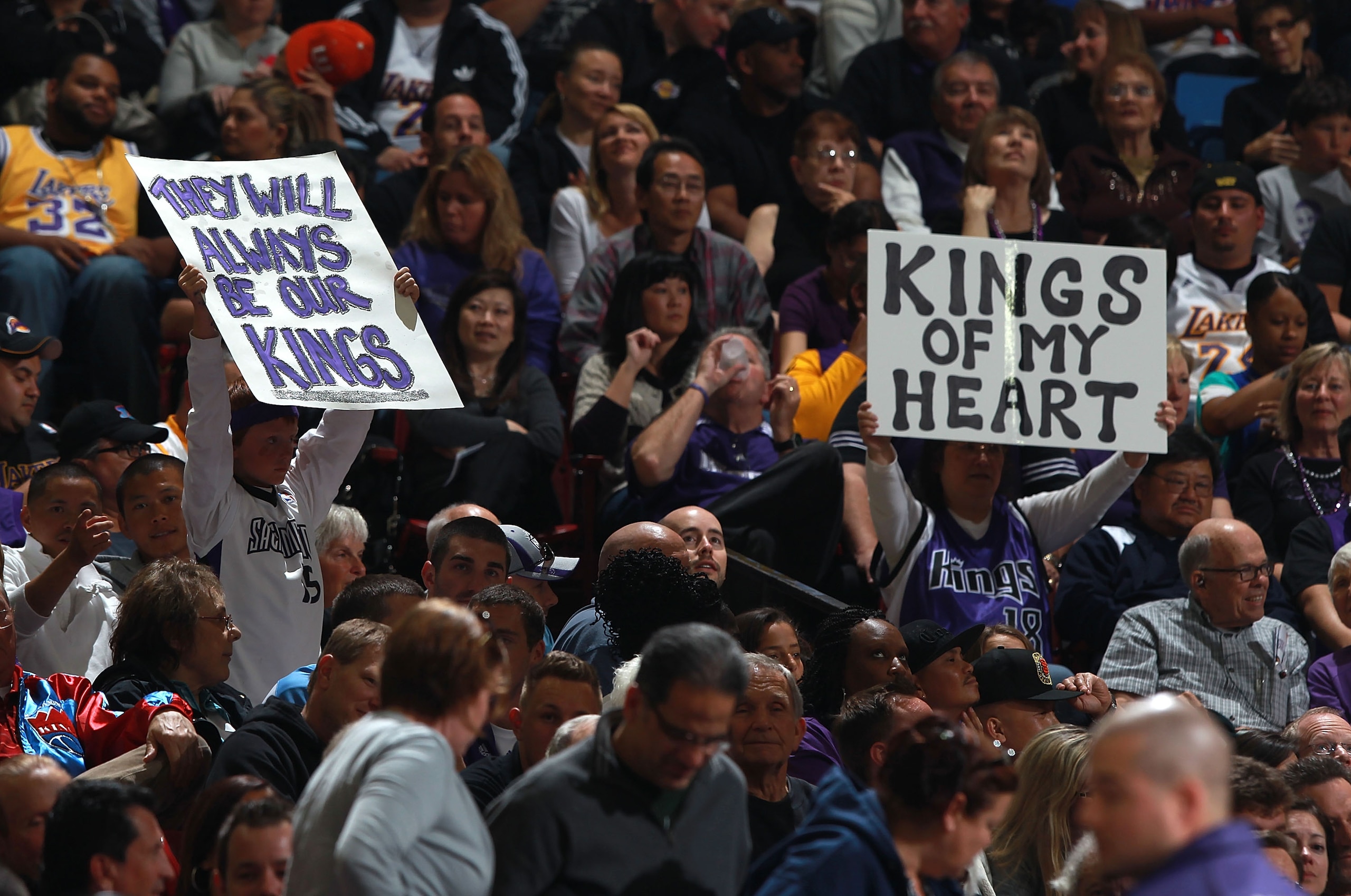 SACRAMENTO, CA - APRIL 13:  Fans of the Sacramento Kings hold up signs against the Los Angeles Lakers on April 13, 2011 at Power Balence Pavilion in Sacramento, California. NOTE TO USER: User expressly acknowledges and agrees that, by downloading and/or u
