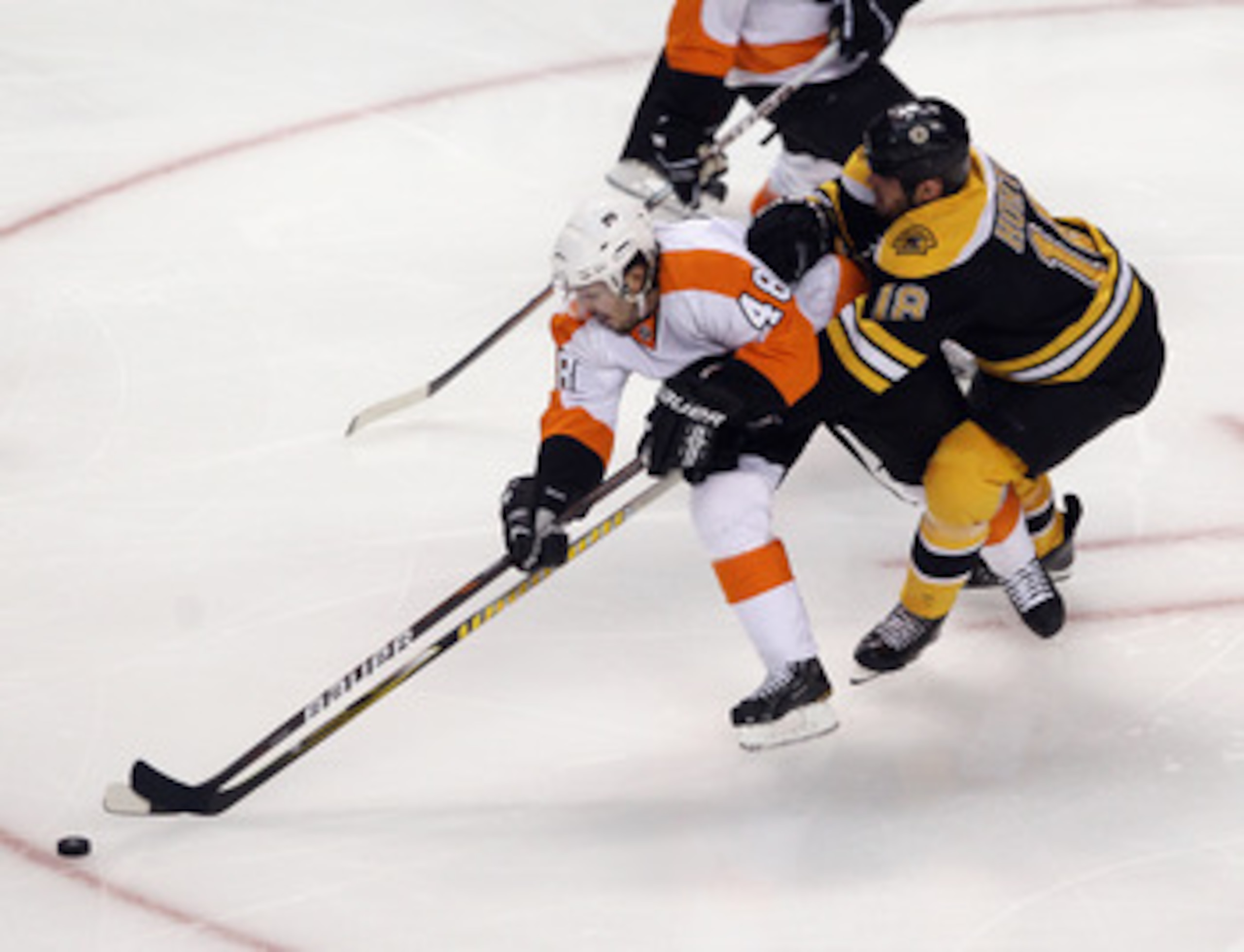 BOSTON, MA - MAY 06: Nathan Horton #18 of the Boston Bruins checks Danny Briere #48 of the Philadelphia Flyers in Game Four of the Eastern Conference Semifinals during the 2011 NHL Stanley Cup Playoffs at TD Garden on May 6, 2011 in Boston, Massachusetts.