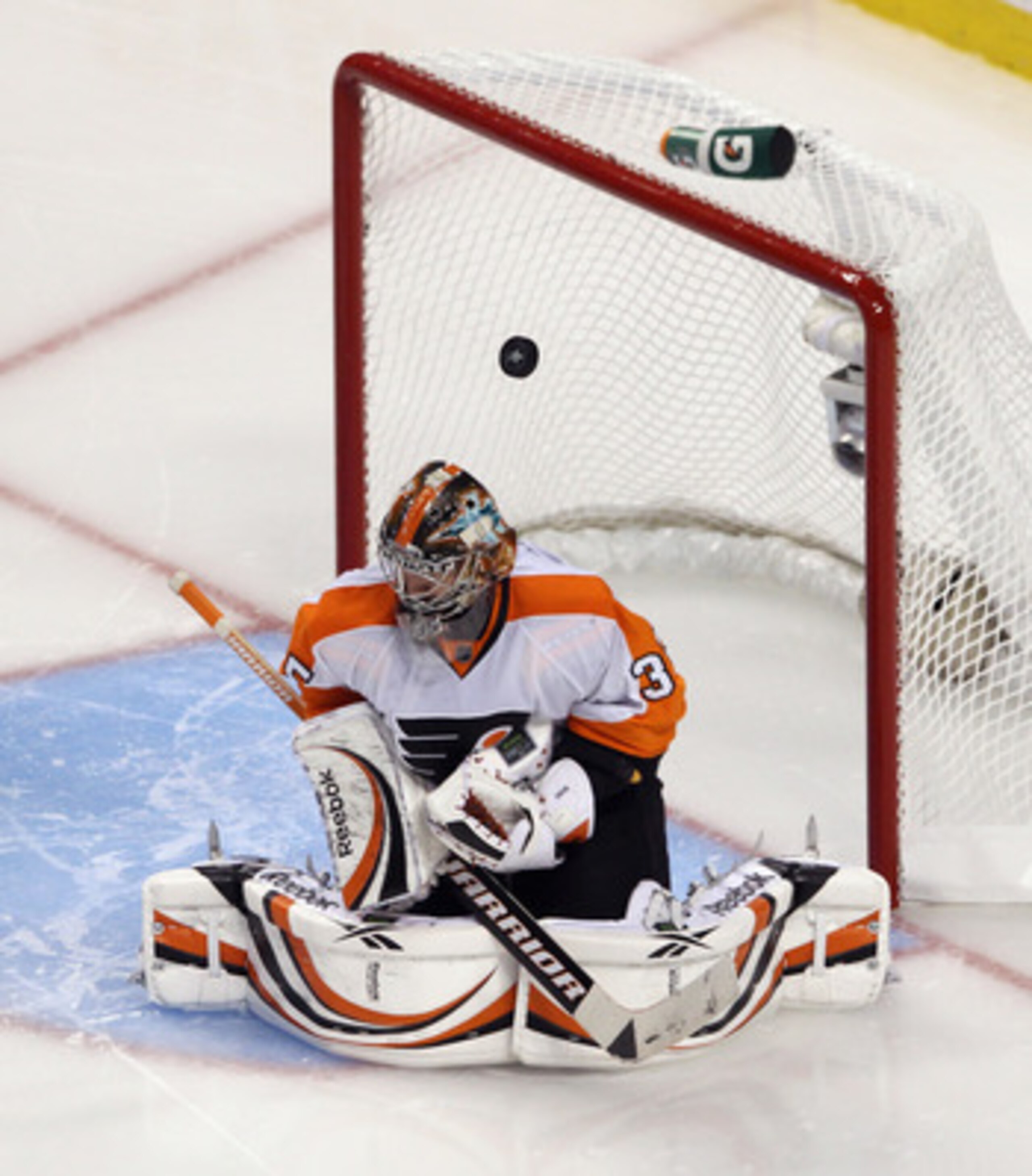 BOSTON, MA - MAY 06:  A puck bounces off the helmet of Sergei Bobrovsky #35 of the Philadelphia Flyers during his game against the Boston Bruins in Game Four of the Eastern Conference Semifinals during the 2011 NHL Stanley Cup Playoffs at TD Garden on May