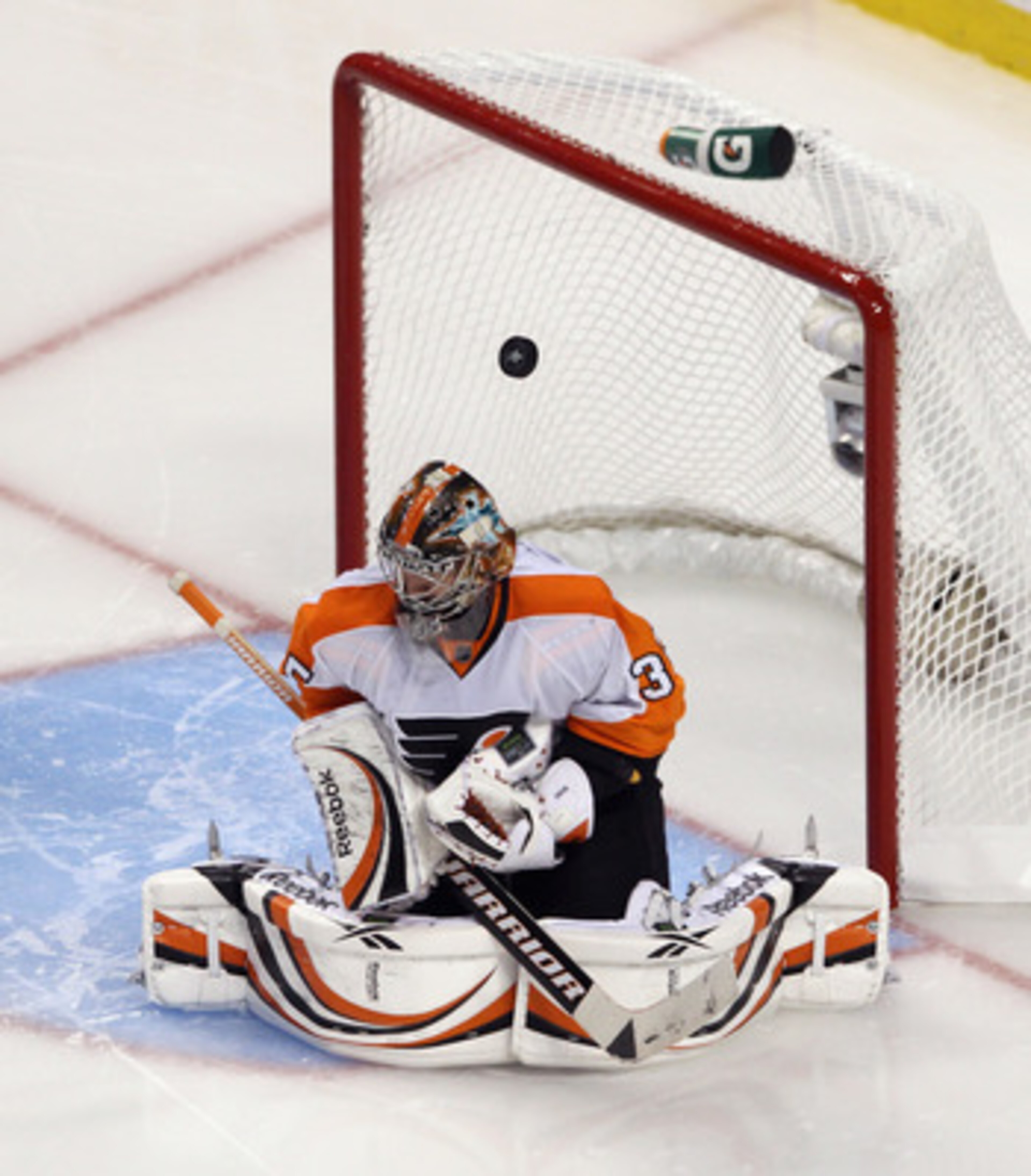 BOSTON, MA - MAY 06:  A puck bounces off the helmet of Sergei Bobrovsky #35 of the Philadelphia Flyers during his game against the Boston Bruins in Game Four of the Eastern Conference Semifinals during the 2011 NHL Stanley Cup Playoffs at TD Garden on May