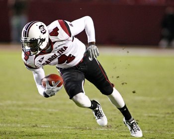 TUSCALOOSA - OCTOBER 17:  Wide receiver Jason Barnes #4 of the South Carolina Gamecocks hauls in a pass and runs upfield during the game against the Alabama Crimson Tide at Bryant-Denny Stadium in Tuscaloosa, Alabama on October 17, 2009.  The Crimson Tide
