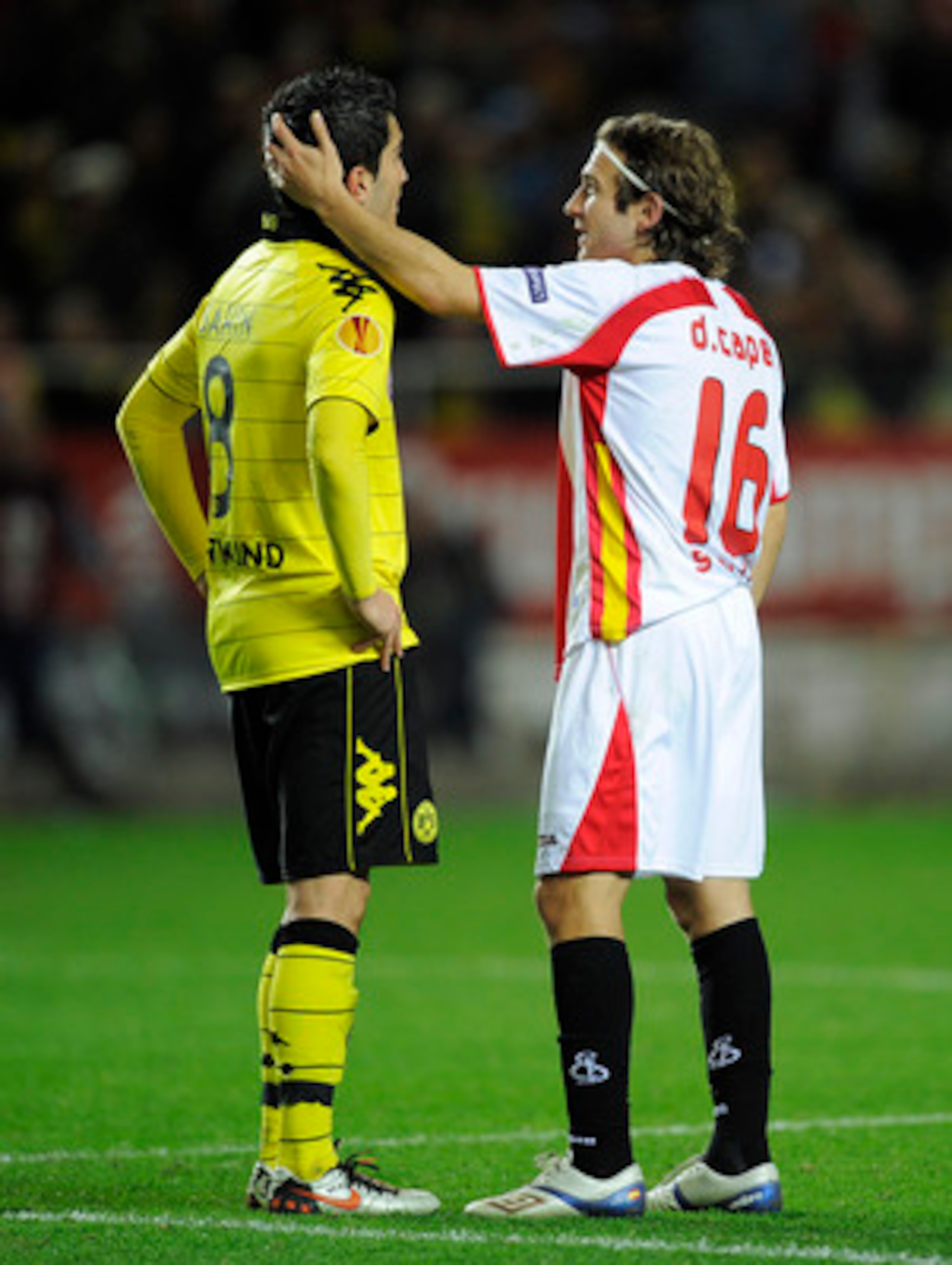 SEVILLE, SPAIN - DECEMBER 15:  Diego Capel of Sevilla (L) talks to Nuri Sahin at the end of the UEFA Europa League group J match between Sevilla and Borussia Dortmund at Estadio Ramon Sanchez Pizjuan on December 15, 2010 in Seville, Spain. The match ended