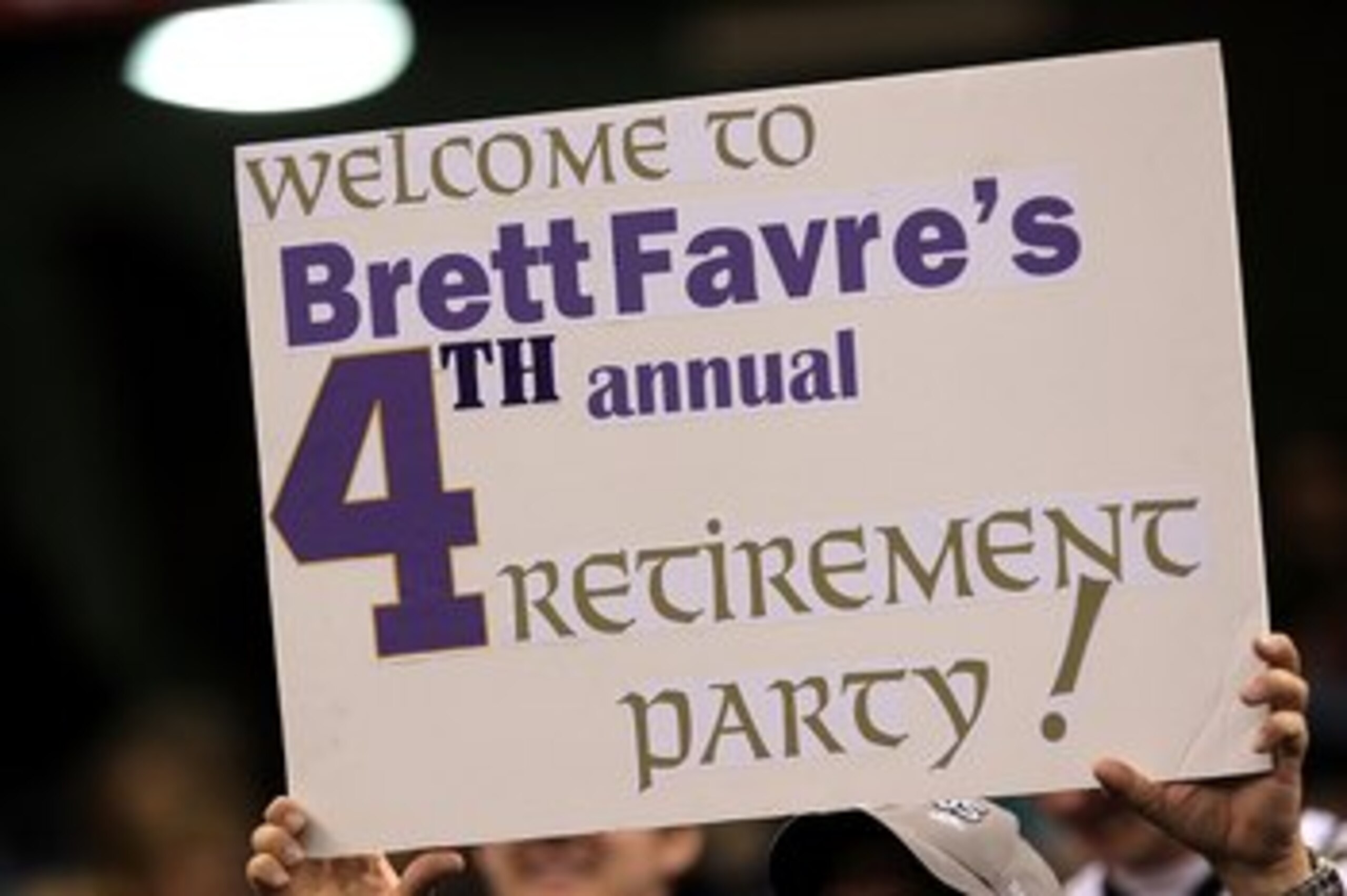 NEW ORLEANS - JANUARY 24:  A fan holds up a sign which reads 'Welcome to Brett Favre's 4th annual Retirement Party!' in reference to Brett Favre #4 of the Minnesota Vikings as he plays against the New Orleans Saints during the NFC Championship Game at the