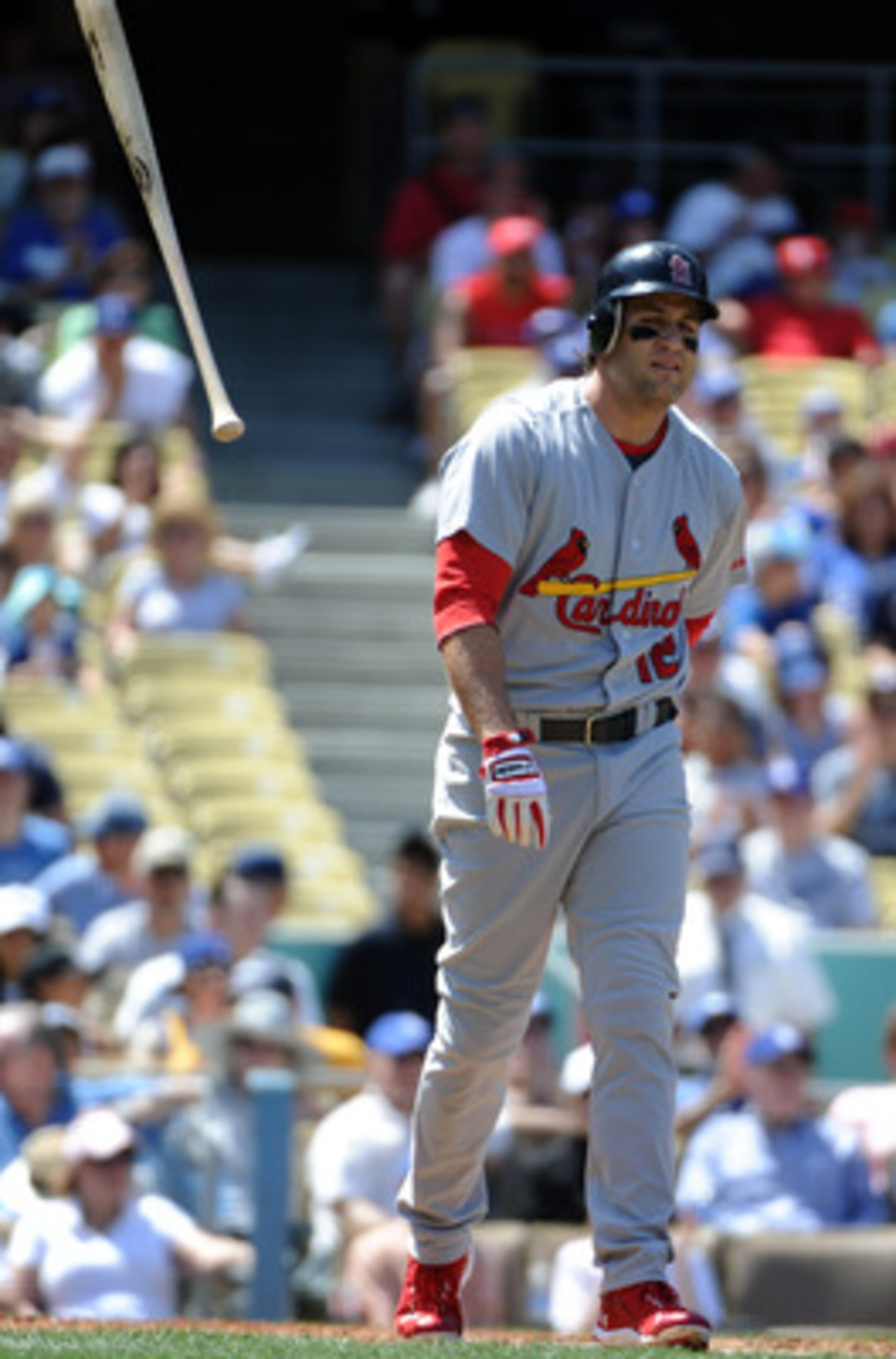 LOS ANGELES, CA - APRIL 17:  Lance Berkman #12 of the St Louis Cardinals tosses his bat in reaction to his strikout against the Los Angeles Dodgers during the third inning at Dodger Stadium on April 17, 2011 in Los Angeles, California.  (Photo by Harry Ho