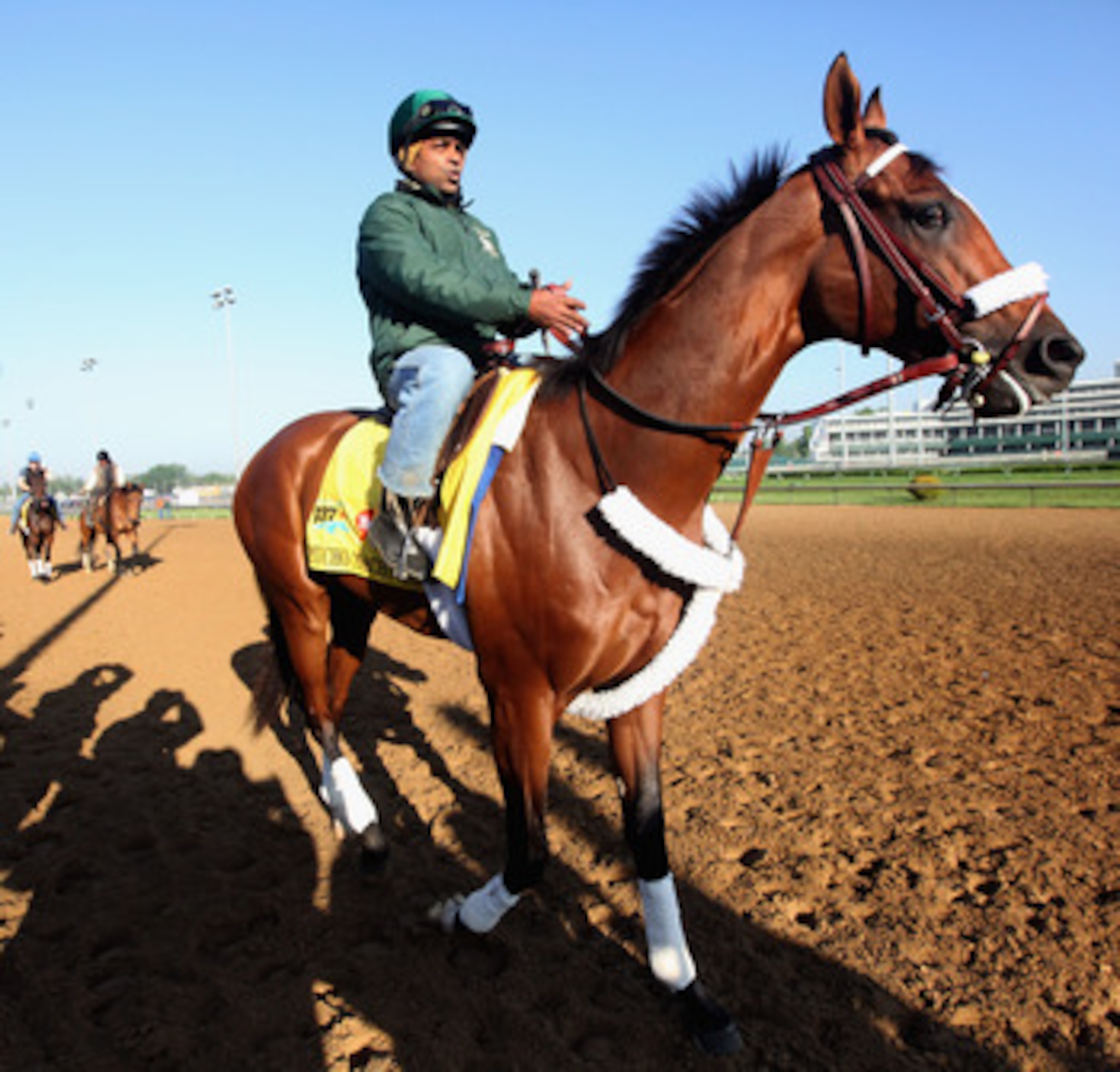 LOUISVILLE, KY - MAY 05:  Kentucky Derby entrant Mucho Macho Man with exercise rider Mike Heera up works during morning workouts in preparation for the 137th running of the Kentucky Derby on May 5, 2011 at Churchill Downs in Louisville, Kentucky.  (Photo 