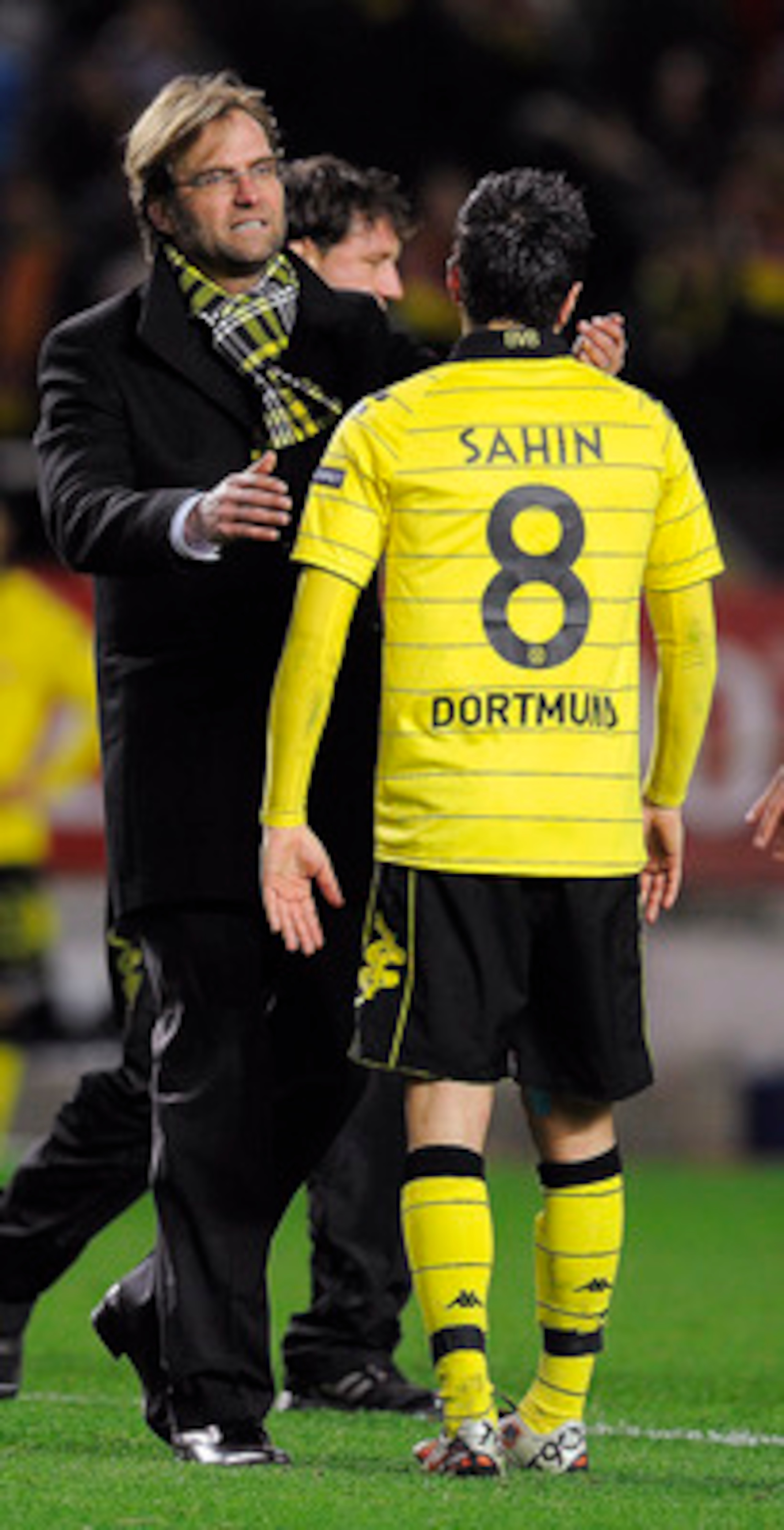 SEVILLE, SPAIN - DECEMBER 15:  Head coach Jurgen Klopp of Borussia Dortmund (L) conforts to Nuri Sahin at the end of the UEFA Europa League group J match between Sevilla and Borussia Dortmund at Estadio Ramon Sanchez Pizjuan on December 15, 2010 in Sevill