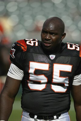 CINCINNATI - SEPTEMBER 29:  Defensive end Reinard Wilson #55 of the Cincinnati Bengals looks on during warms ups before the game against the Tampa Bay Buccaneers on September 29, 2002 at Paul Brown Stadium in Cincinnati, Ohio.  The Buccaneers defeated the