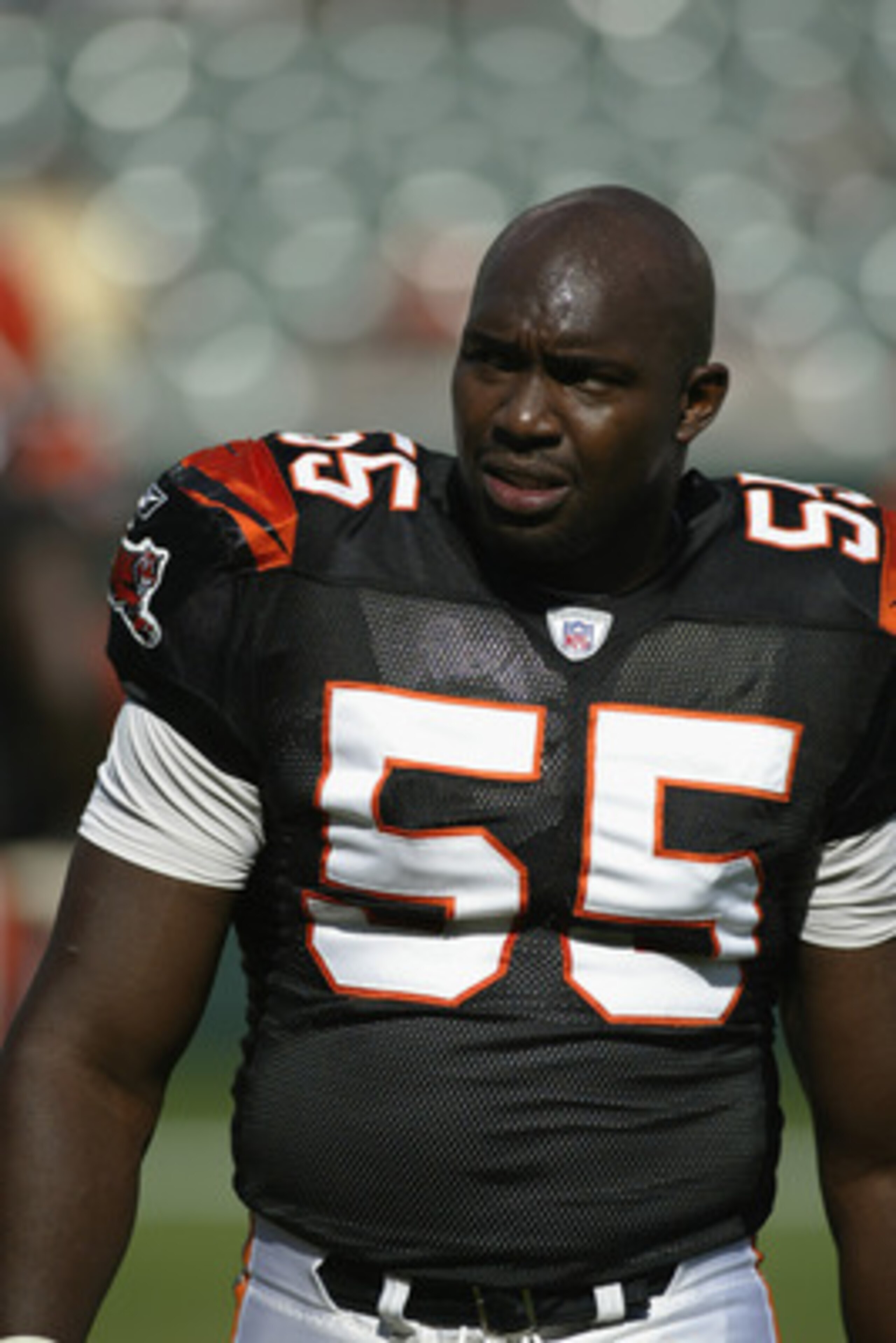 CINCINNATI - SEPTEMBER 29:  Defensive end Reinard Wilson #55 of the Cincinnati Bengals looks on during warms ups before the game against the Tampa Bay Buccaneers on September 29, 2002 at Paul Brown Stadium in Cincinnati, Ohio.  The Buccaneers defeated the