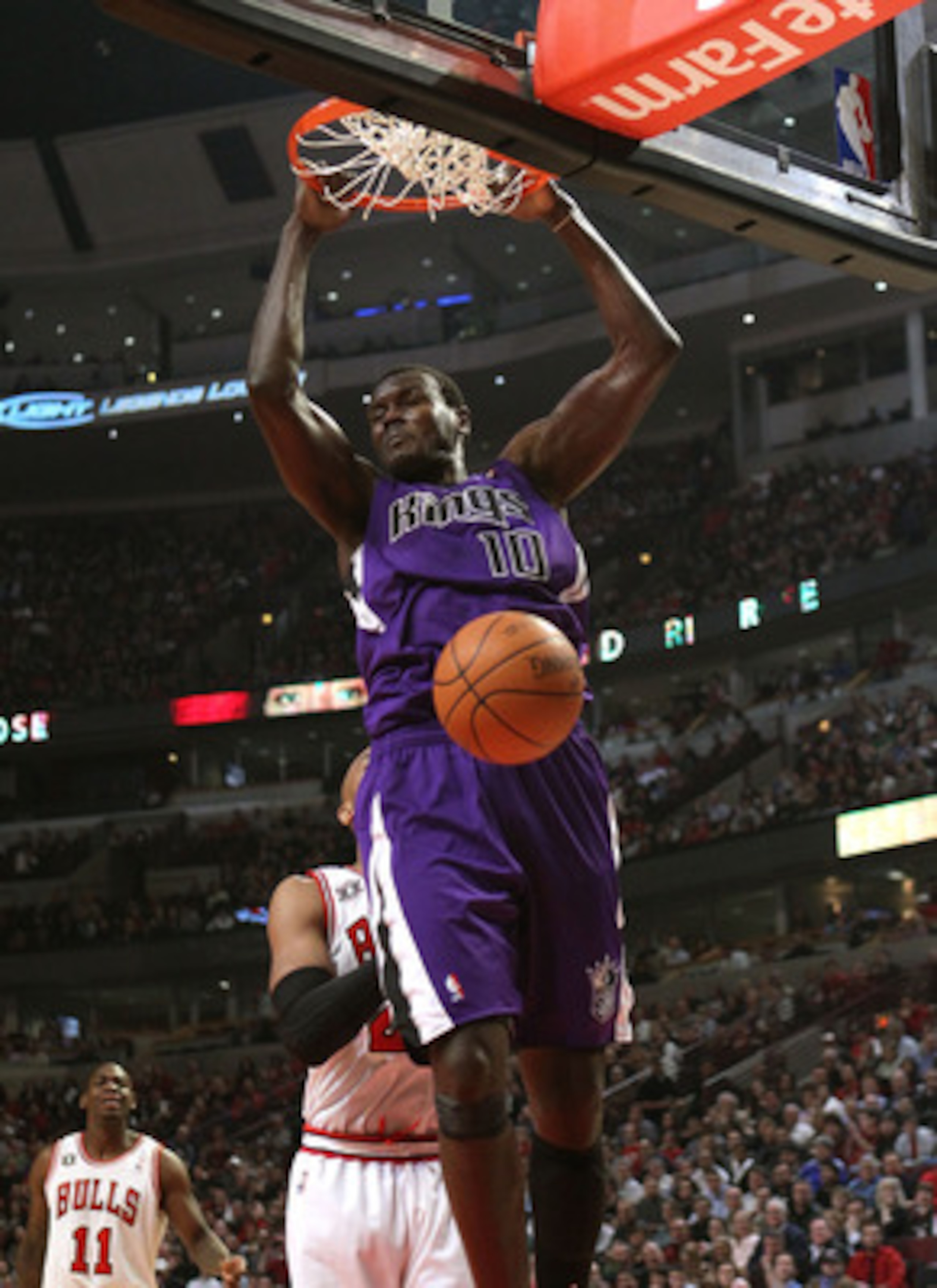 CHICAGO, IL - MARCH 21: Samuel Dalembert #10 of the Sacramento Kings dunks the ball against the Chicago Bulls at the United Center on March 21, 2011 in Chicago, Illinois. NOTE TO USER: User expressly acknowledges and agrees that, by downloading and/or usi