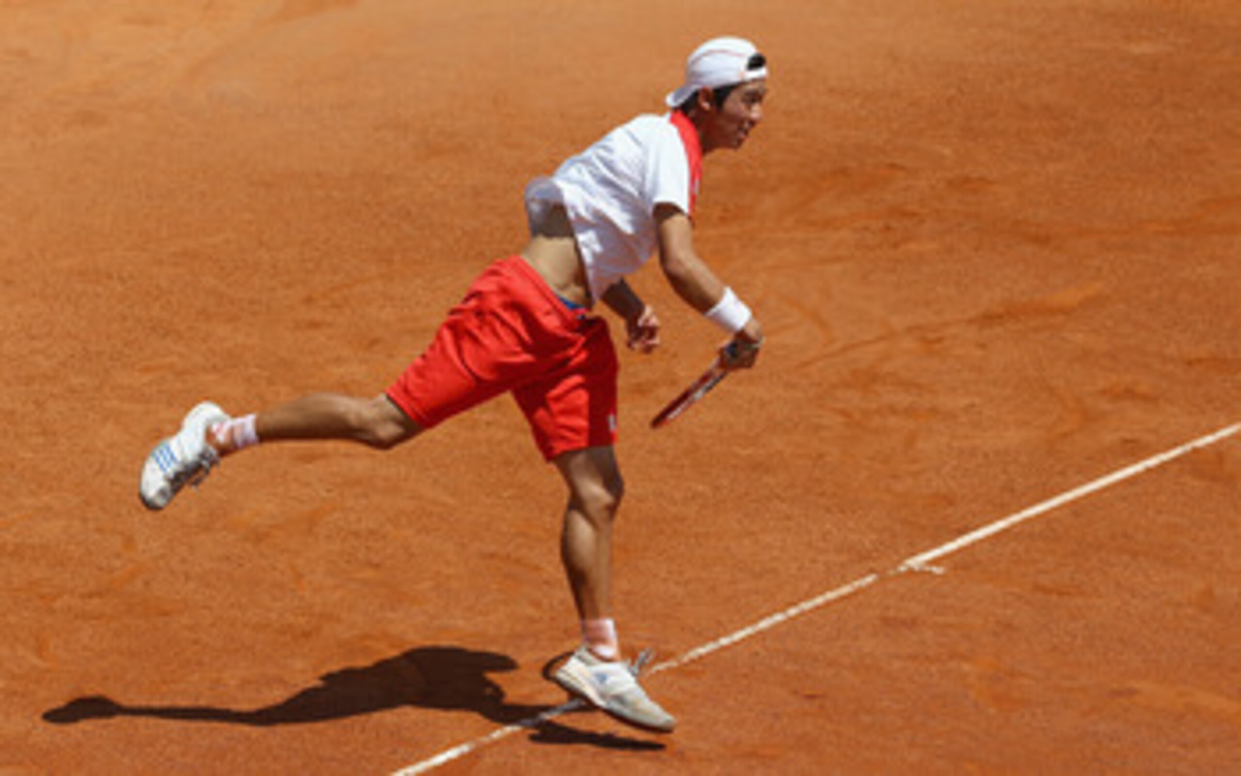 ROME, ITALY - MAY 08:  Kei Nishikori of Japan serves during his first round match against Federico Del Bonis of Argentina during day one of the Internazoinali BNL D'Italia at the Foro Italico Tennis Centre on May 8, 2011 in Rome, Italy.  (Photo by Clive B