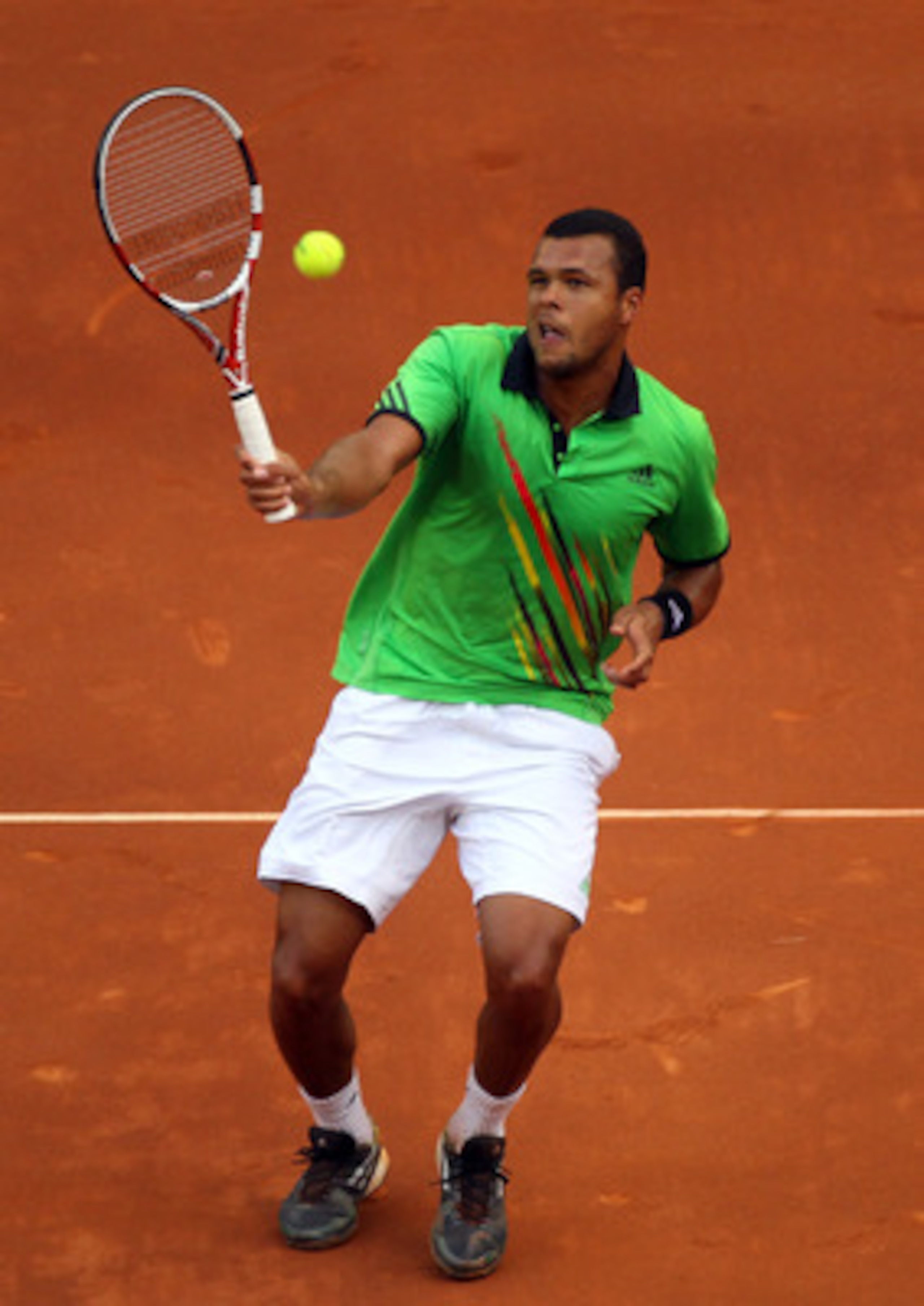 MADRID, SPAIN - MAY 01:  Jo-Wilfried Tsonga of France in action against Nicolas Almagro of Spain during day two of the Mutua Madrilena Madrid Open Tennis on May 1, 2011 in Madrid, Spain.  (Photo by Julian Finney/Getty Images)