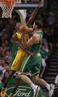 BOSTON, MA - MARCH 16:  Paul George #24 of the Indiana Pacers fouls Nenad Krstic #4 of the Boston Celtics on March 16, 2011 at the TD Garden in Boston, Massachusetts. The Celtics defeated the Indiana Pacers 92-80. NOTE TO USER: User expressly acknowledges