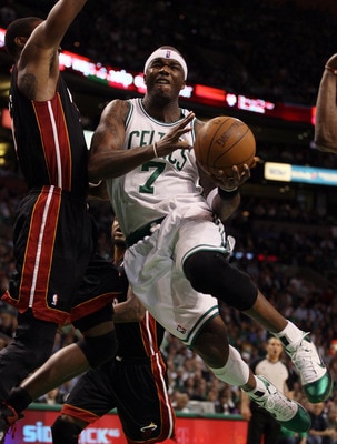 BOSTON, MA - MAY 09: Jermaine O'Neal #7 of the Boston Celtics drives past Mario Chalmers #15 of the Miami Heat in Game Four of the Eastern Conference Semifinals in the 2011 NBA Playoffs on May 9, 2011 at the TD Garden in Boston, Massachusetts.  NOTE TO US