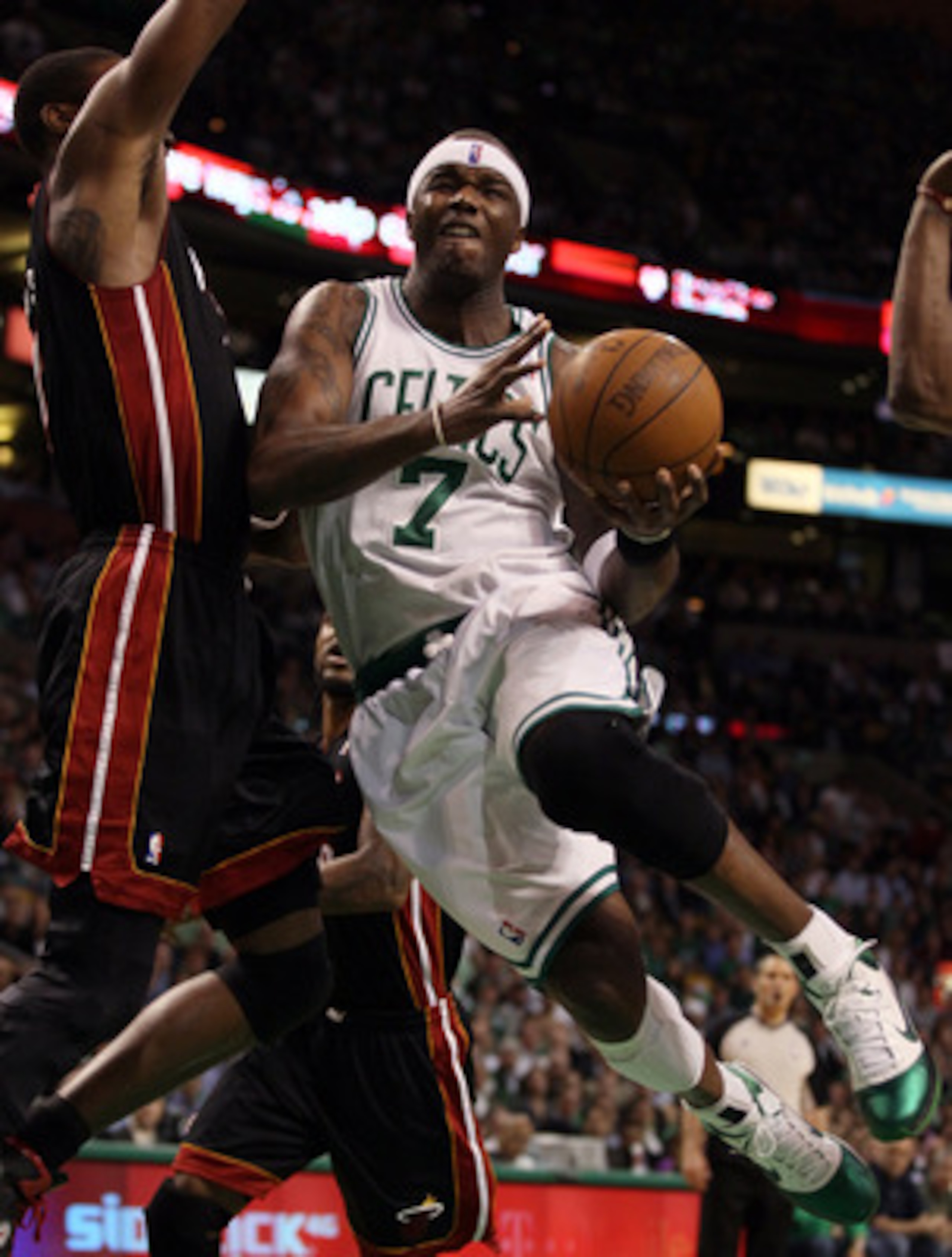 BOSTON, MA - MAY 09: Jermaine O'Neal #7 of the Boston Celtics drives past Mario Chalmers #15 of the Miami Heat in Game Four of the Eastern Conference Semifinals in the 2011 NBA Playoffs on May 9, 2011 at the TD Garden in Boston, Massachusetts.  NOTE TO US
