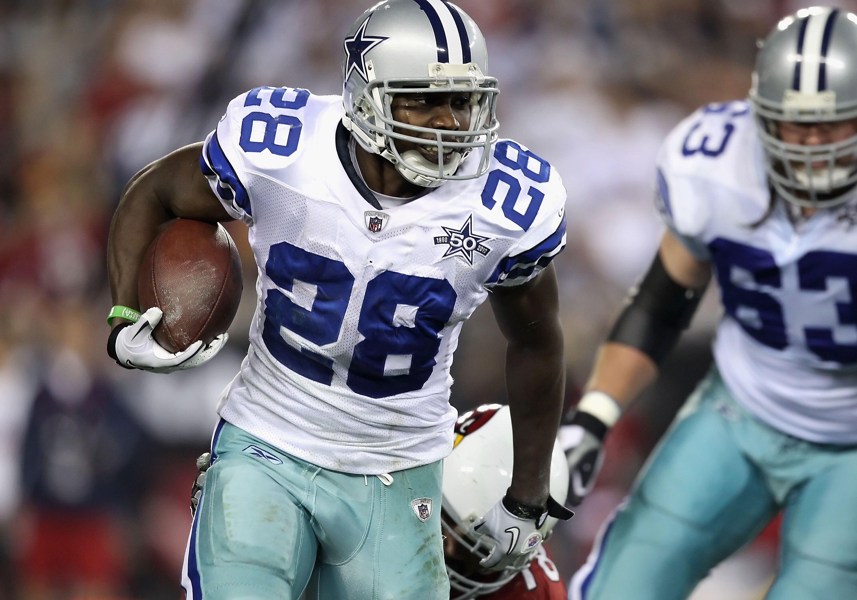 GLENDALE, AZ - DECEMBER 25: Runningback Felix Jones #28 of the Dallas Cowboys rushes the football during the NFL game against the Arizona Cardinals at the University of Phoenix Stadium on December 25, 2010 in Glendale, Arizona. The Cardinals defeated th GLENDALE, AZ - DECEMBER 25: Runningback Felix Jones #28 of the Dallas Cowboys rushes the football during the NFL game against the Arizona Cardinals at the University of Phoenix Stadium on December 25, 2010 in Glendale, Arizona. The Cardinals defeated th