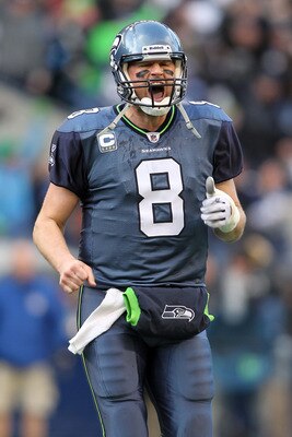 SEATTLE, WA - JANUARY 08:  Quarterback Matt Hasselbeck #8 of the Seattle Seahawks reacts after he throws a 45-yard touchdown pass to Brandon Stokley #15 in the second quarter against the New Orleans Saints during the 2011 NFC wild-card playoff game at Qwe