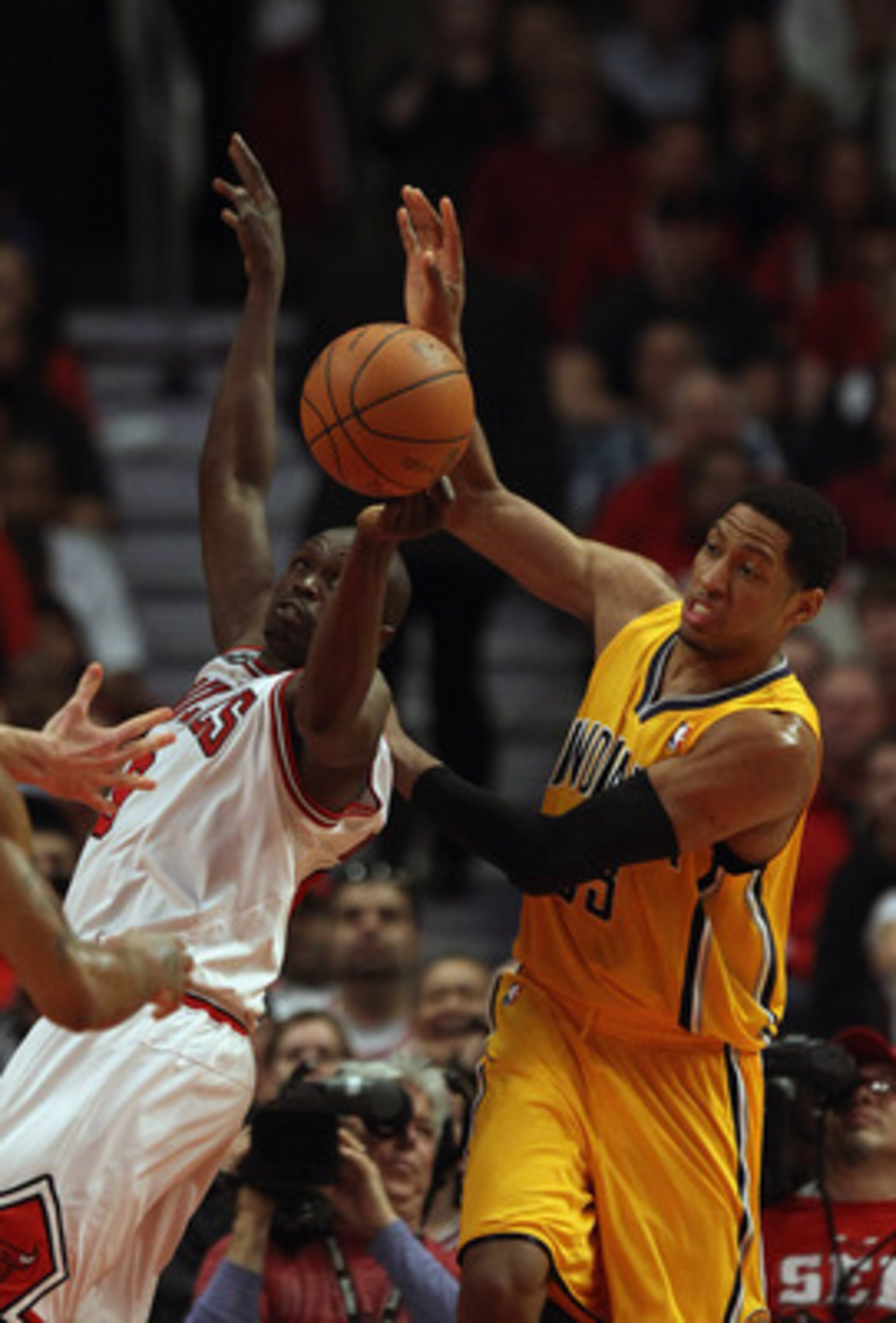 CHICAGO, IL - APRIL 26: Loul Deng #9 of the Chicago Bulls battles for a rebound with Danny Granger #33 of the Indiana Pacers in Game Five of the Eastern Conference Quarterfinals in the 2011 NBA Playoffs at the United Center on April 26, 2011 in Chicago, I