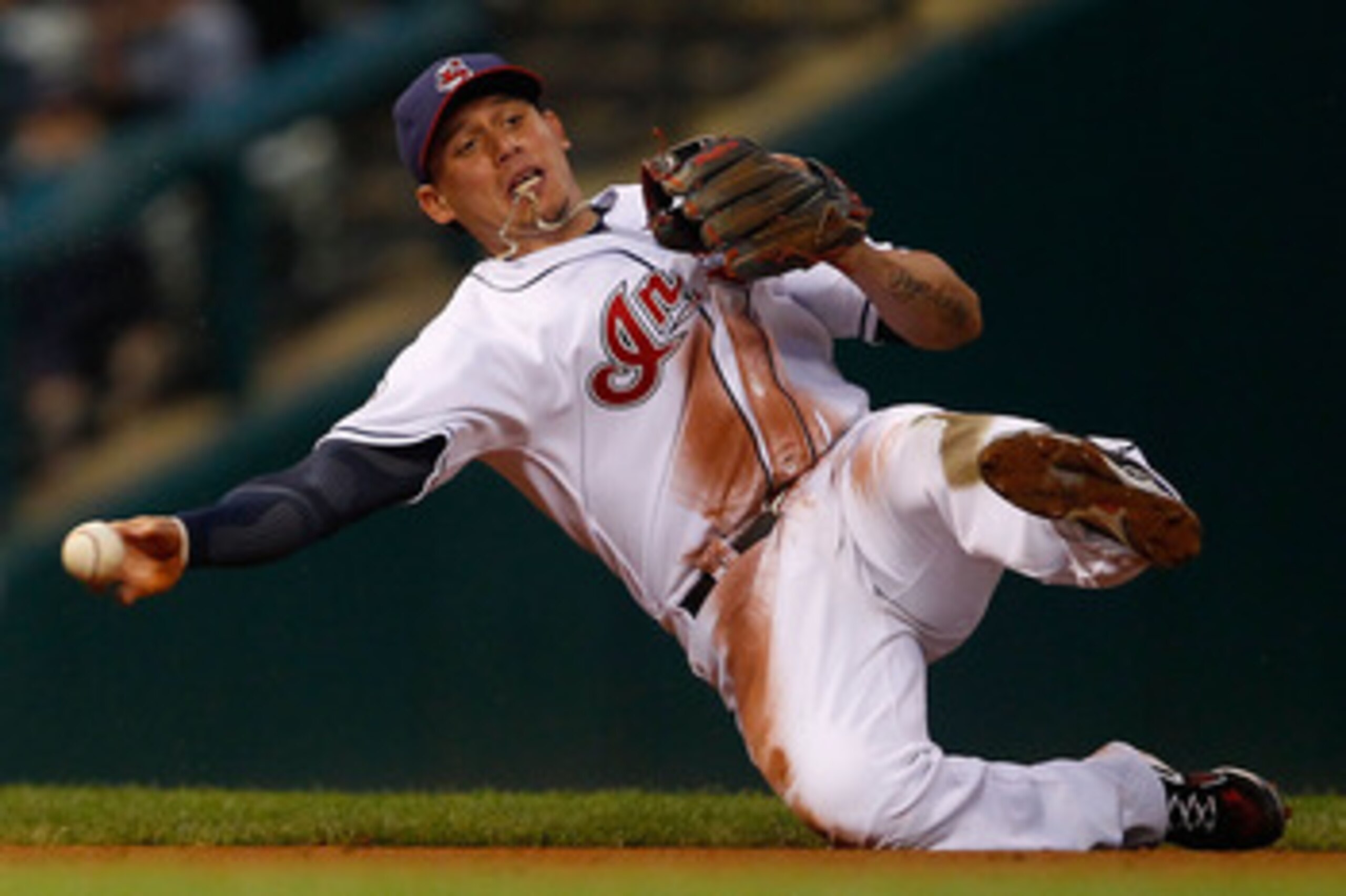 CLEVELAND - MAY 13:  Asdrubal Cabrera #13 of the Cleveland Indians fields a ground ball against the Seattle Mariners during the game on May 13, 2011 at Progressive Field in Cleveland, Ohio.  (Photo by Jared Wickerham/Getty Images)
