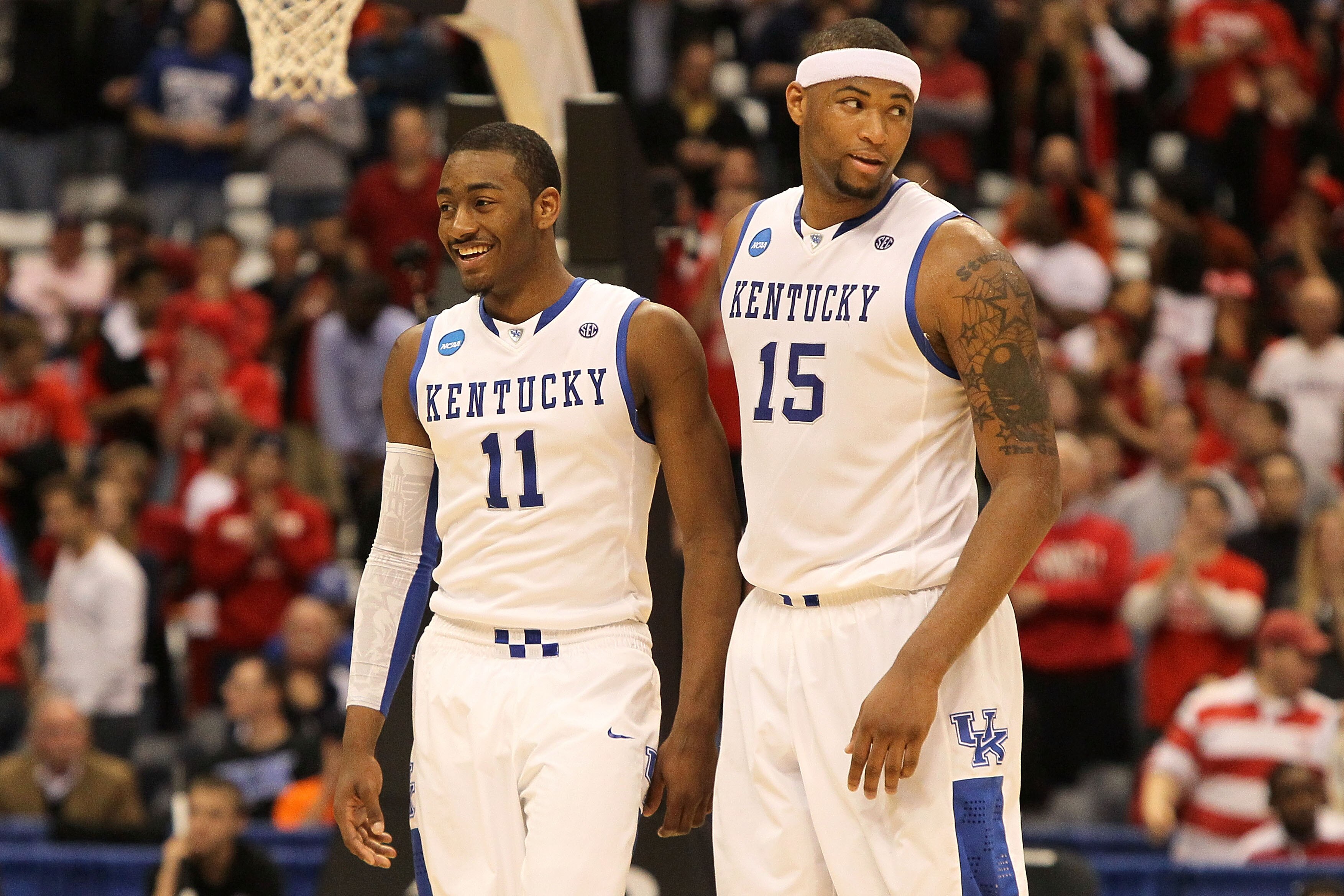 SYRACUSE, NY - MARCH 25:  (L-R) John Wall #11 and DeMarcus Cousins #15 of the Kentucky Wildcats react late in the second half against the Cornell Big Red during the east regional semifinal of the 2010 NCAA men's basketball tournament at the Carrier Dome o