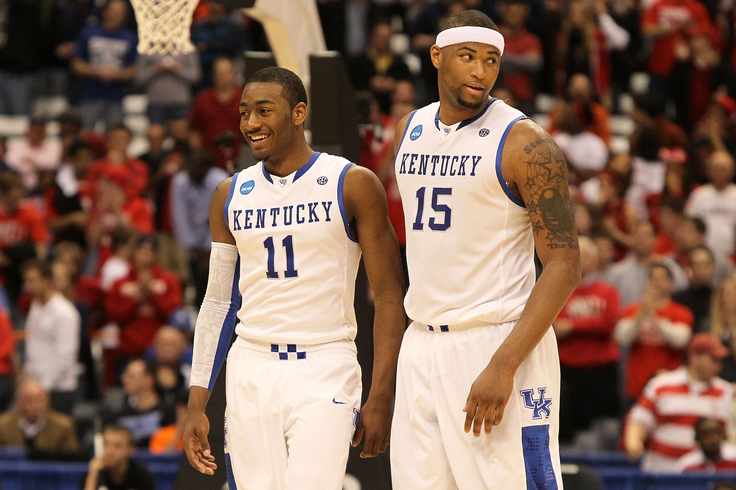 SYRACUSE, NY - MARCH 25:  (L-R) John Wall #11 and DeMarcus Cousins #15 of the Kentucky Wildcats react late in the second half against the Cornell Big Red during the east regional semifinal of the 2010 NCAA men's basketball tournament at the Carrier Dome o